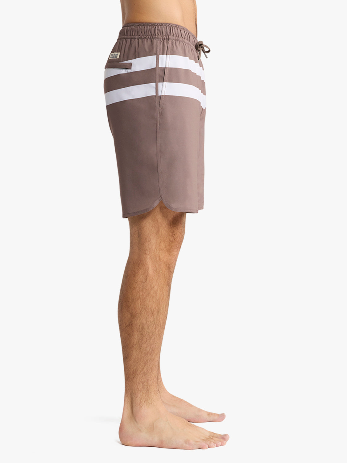 Brown swim trunk with horizontal white stripes and drawstring waistband displayed on a man.