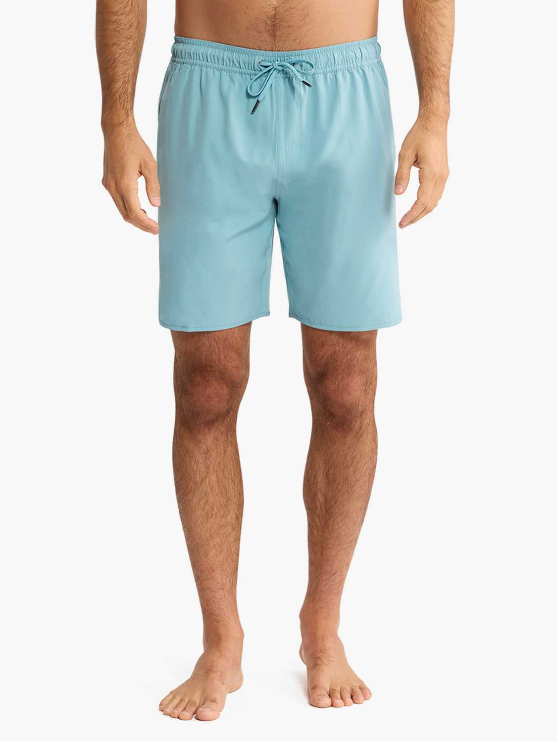 Man wearing light blue swim shorts with a drawstring waist and knee-length cut.