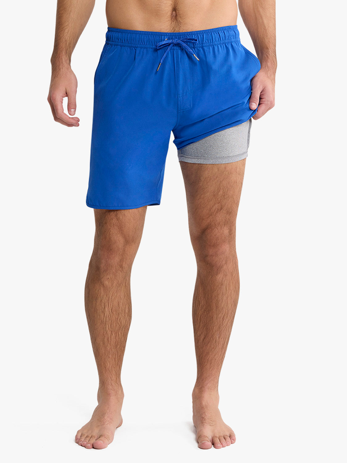 Cobalt blue swim trunk with gray contrast shorts visible underneath and drawstring waist closure.