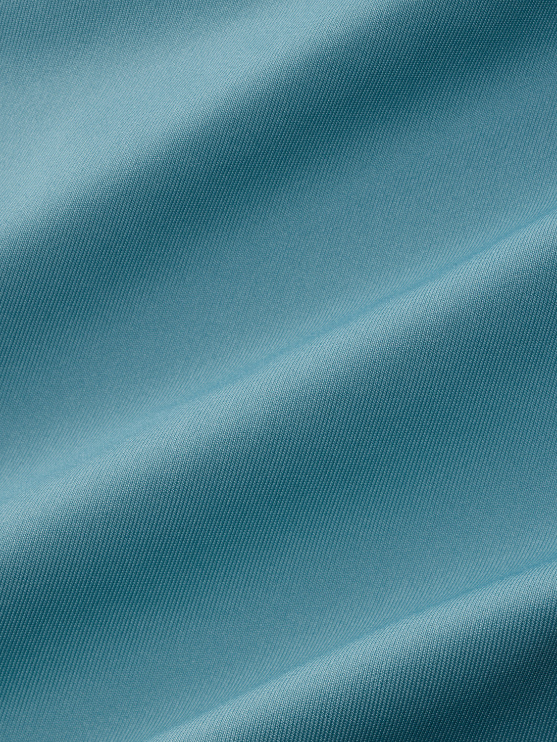Bay blue rashguard fabric displayed showing textured ribbed weave and matte finish.