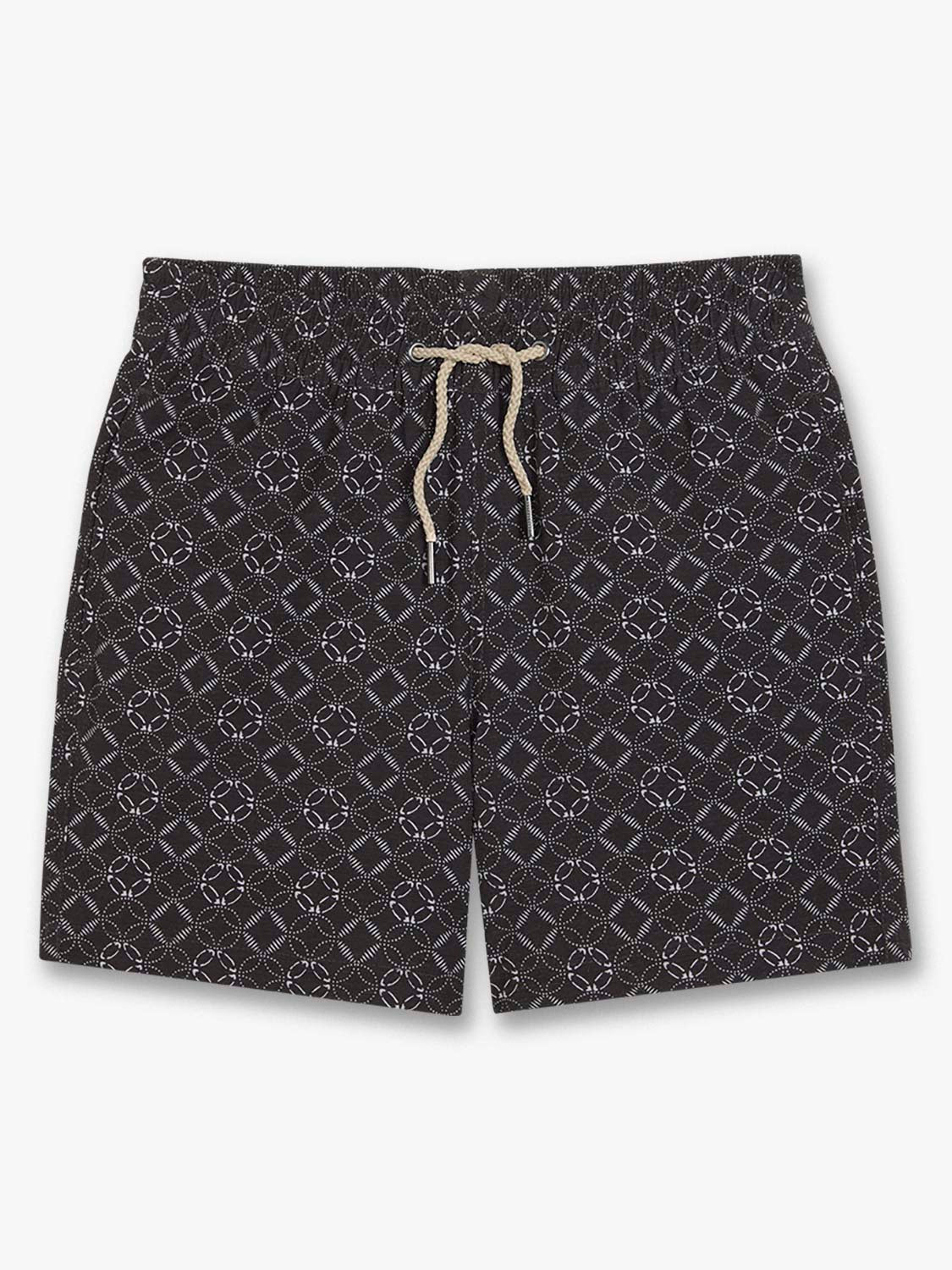 Black kids swim trunk with white circular geometric pattern and cream-colored drawstring closure.