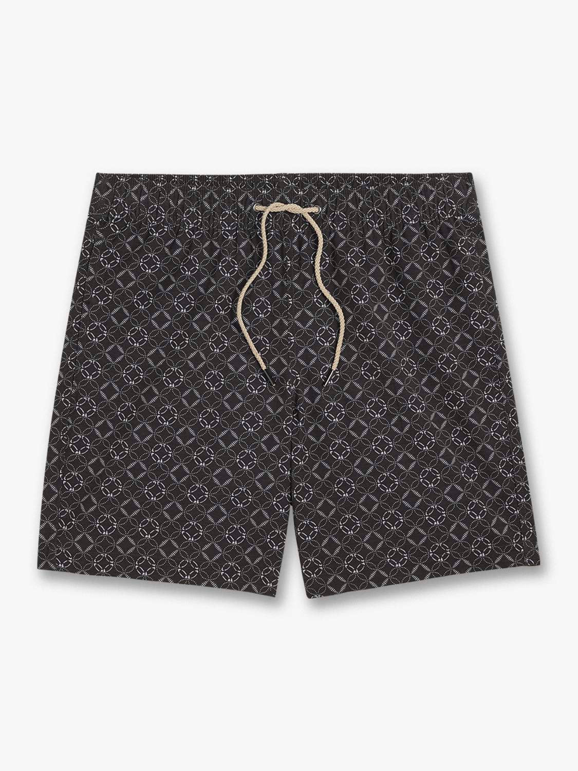 Dark swim trunks with repeating geometric circle and diamond pattern and tan drawstring.