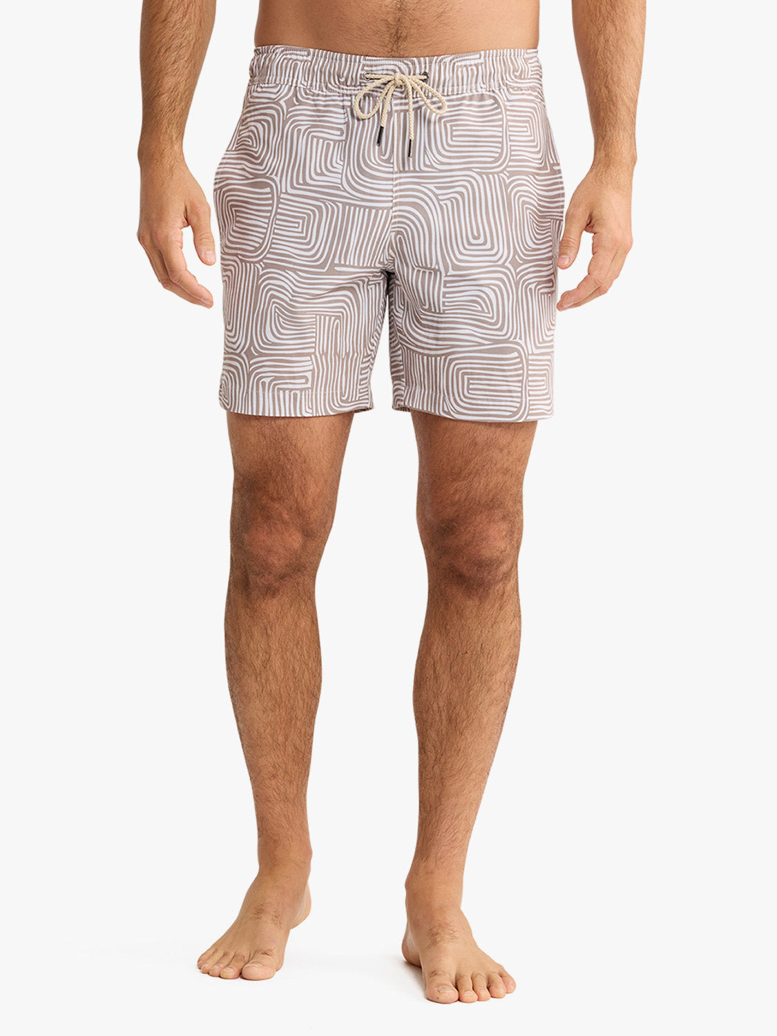 Men's swim trunks featuring a wavy geometric pattern in beige and white with drawstring waist.