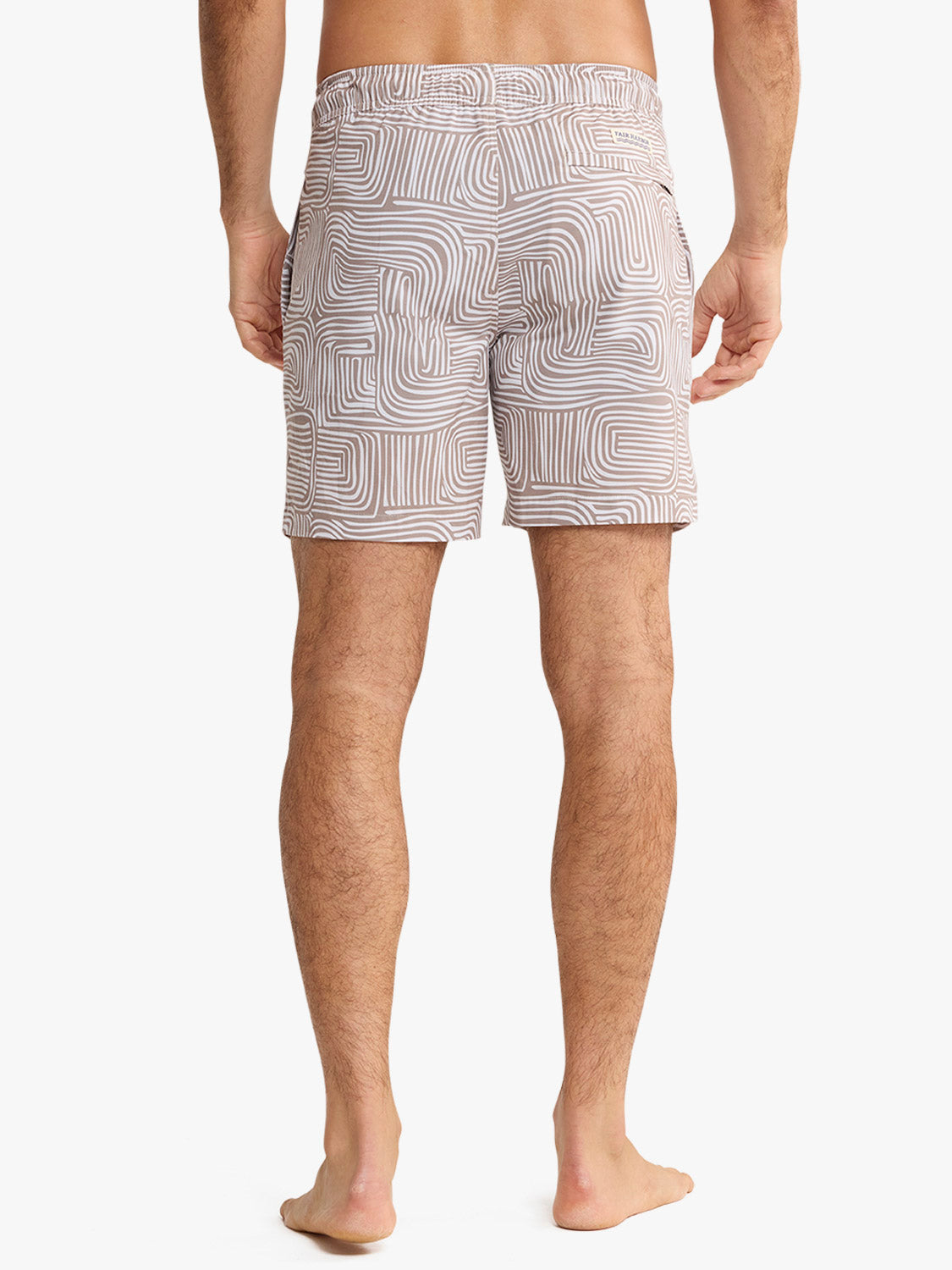Men's swim trunk featuring a wavy striped pattern in beige and white tones.