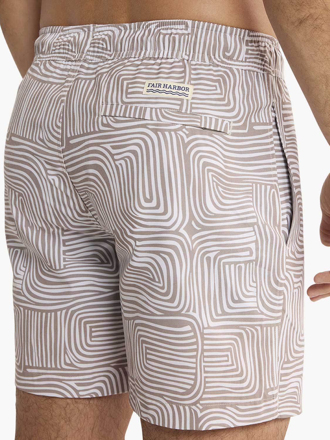 Men's swim trunks featuring a tan and white wavy geometric pattern with Fair Harbor label.