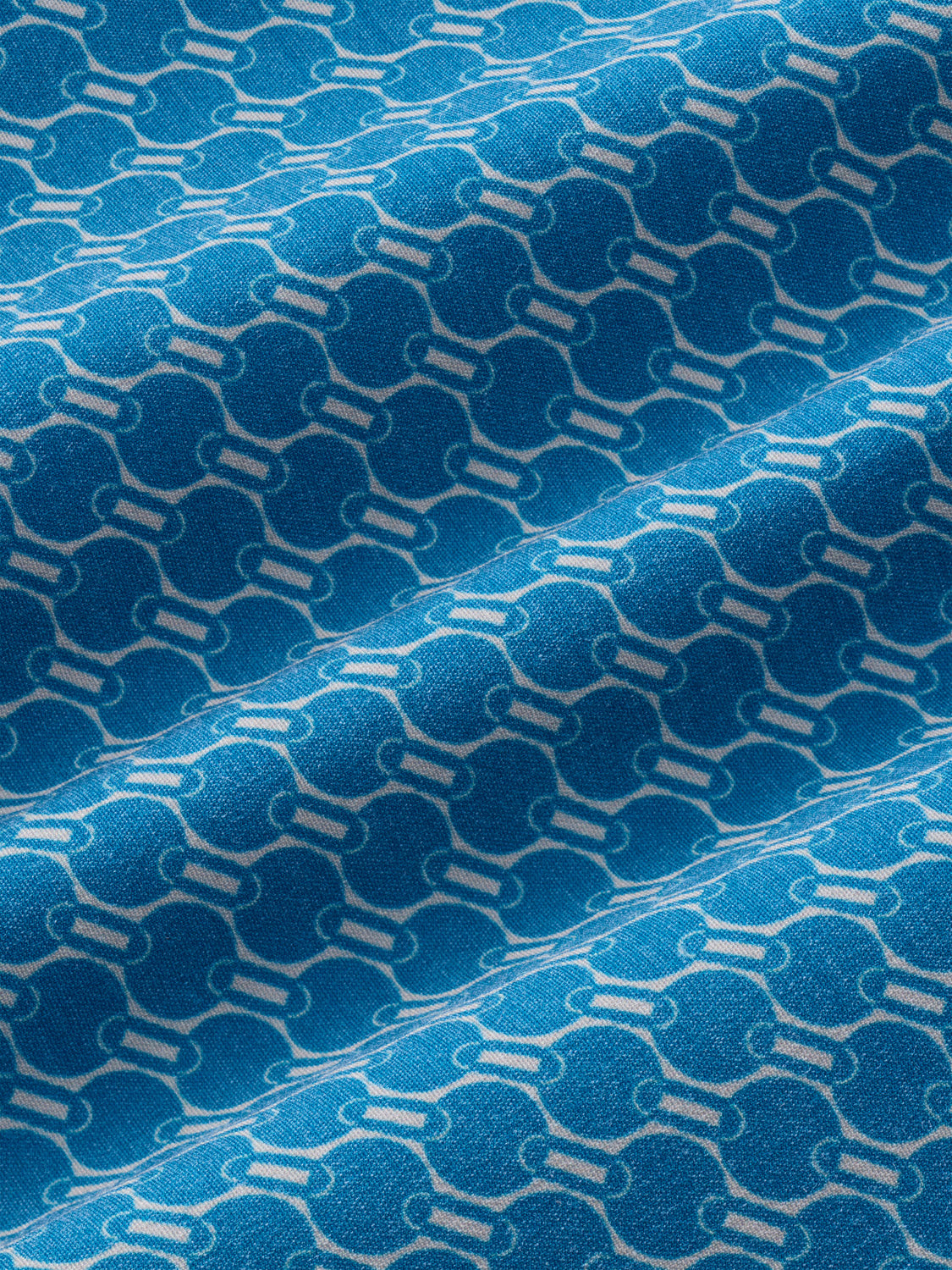 Teal swimsuit fabric with a repeating geometric wave and linear pattern in cream and white tones.