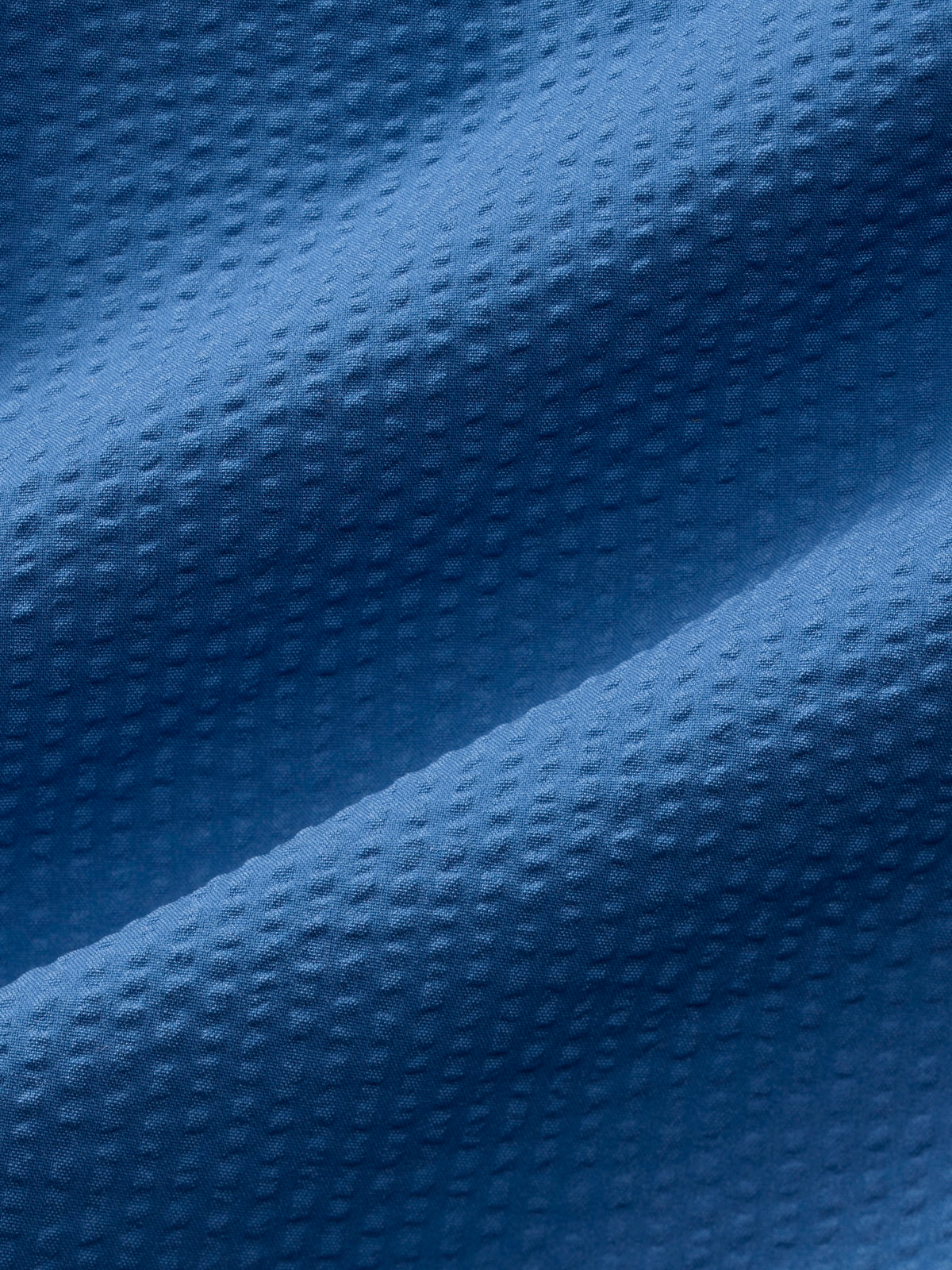 Close-up of textured blue fabric