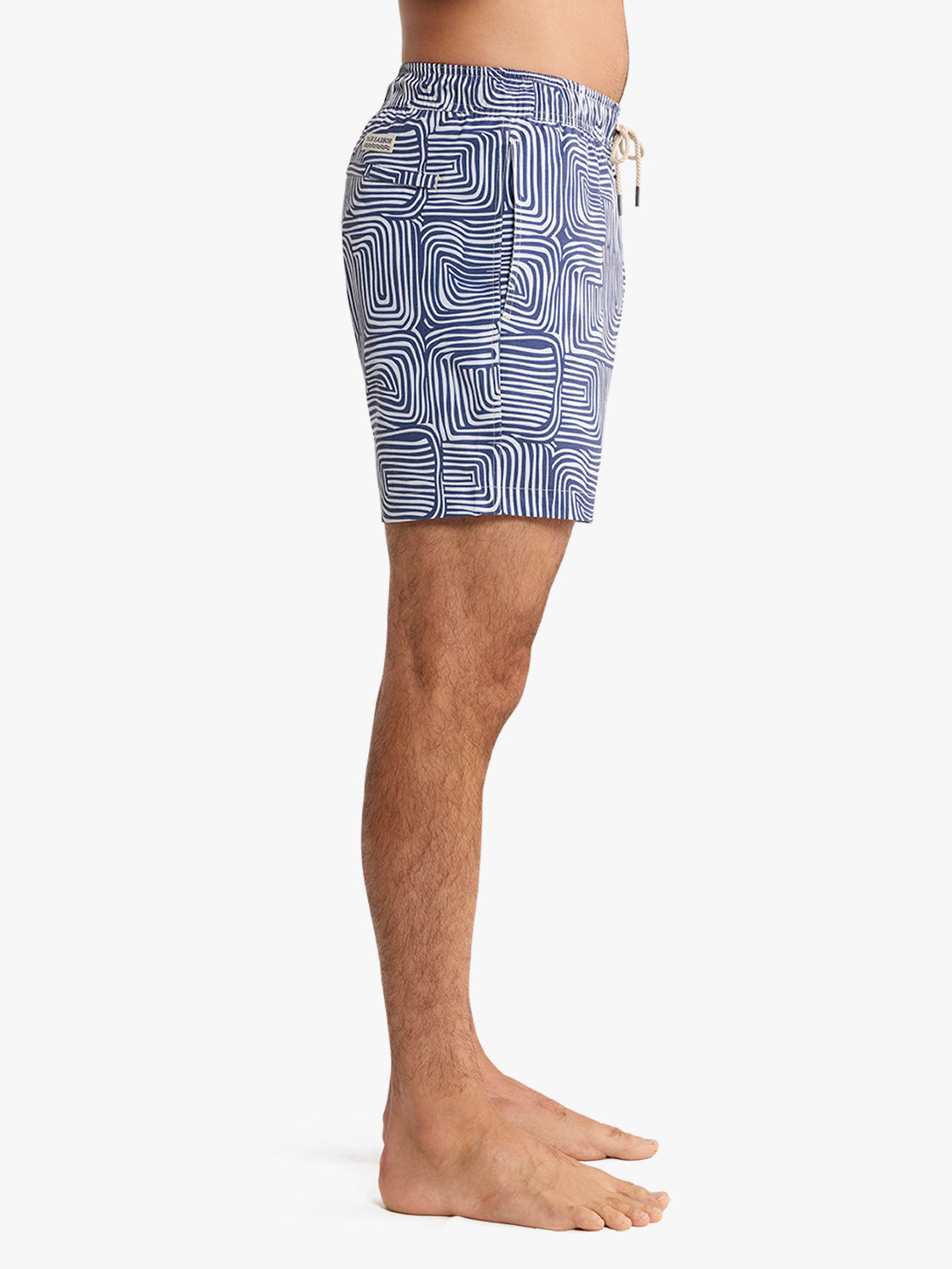 Navy and white wavy geometric patterned swim trunk with drawstring waistband and side pocket.