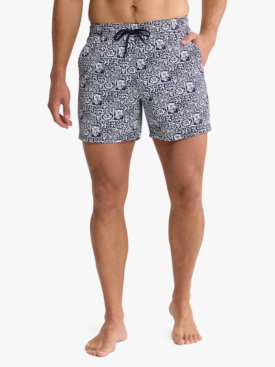 Men's swim shorts in navy and white geometric tile pattern with drawstring waist.