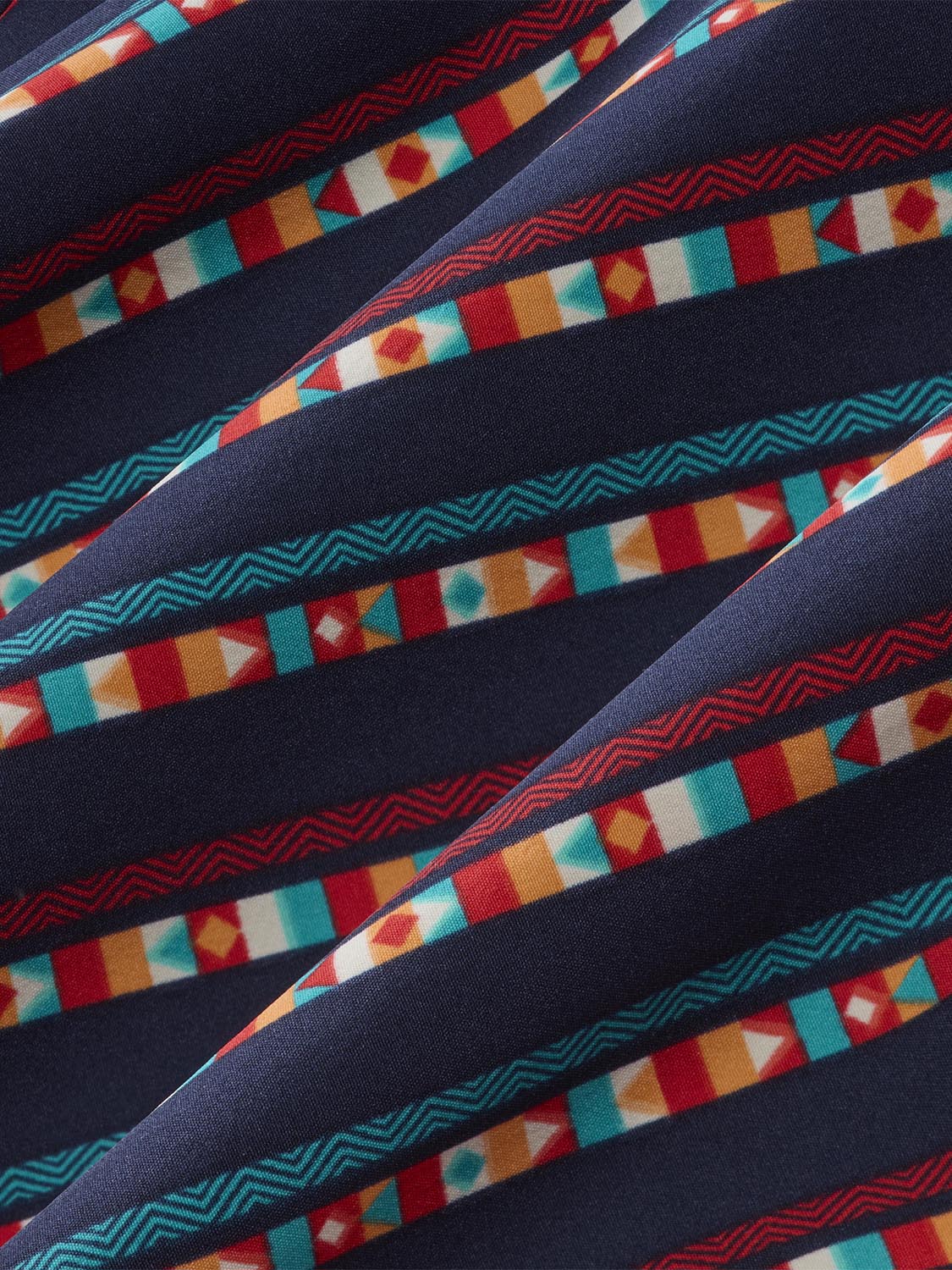 Navy fabric with horizontal stripes alternating between geometric patterns in red, teal, orange, and cream colors.
