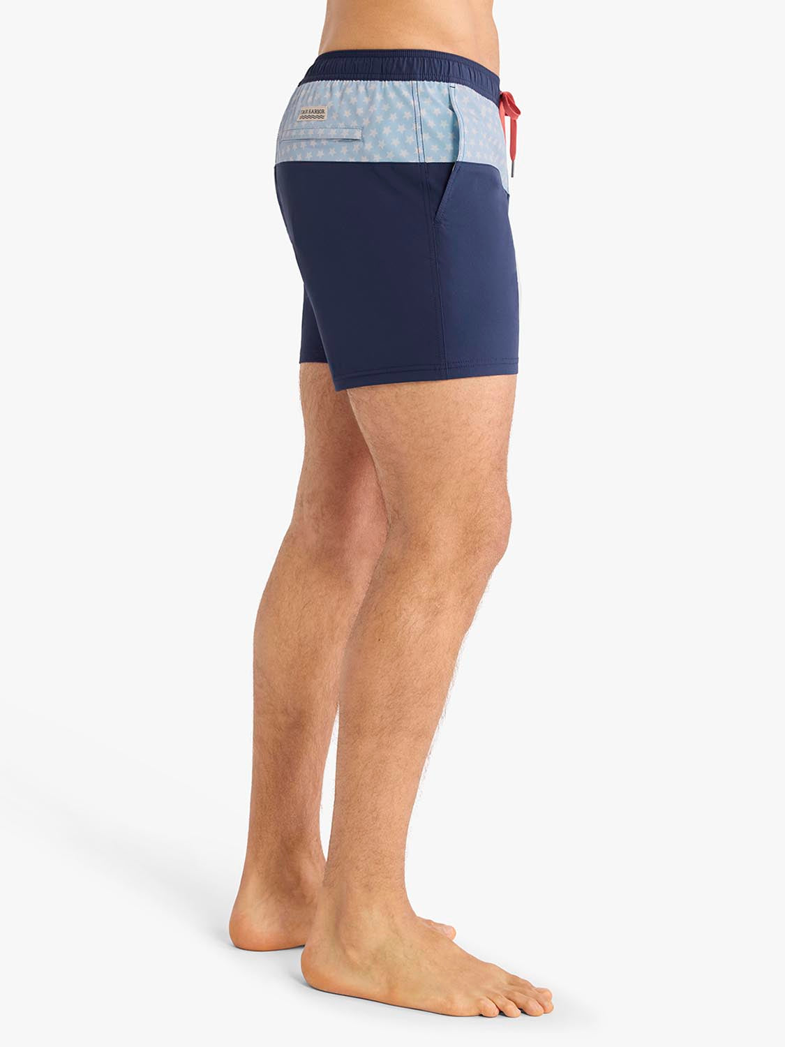Navy and light blue swim trunks with a contrast waistband and red drawstring detail.