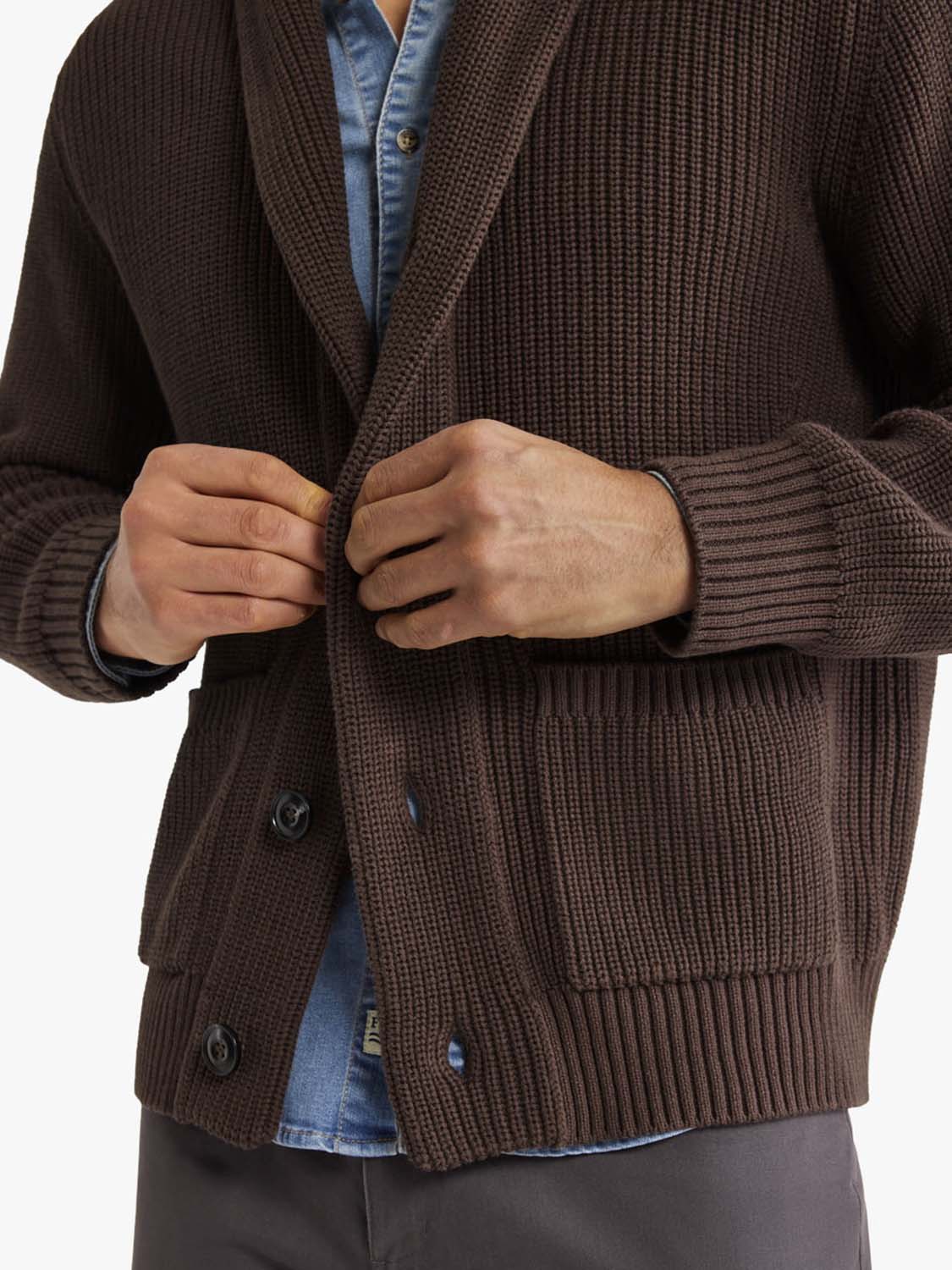 Dark brown textured blazer-style sweater worn over a blue denim shirt.