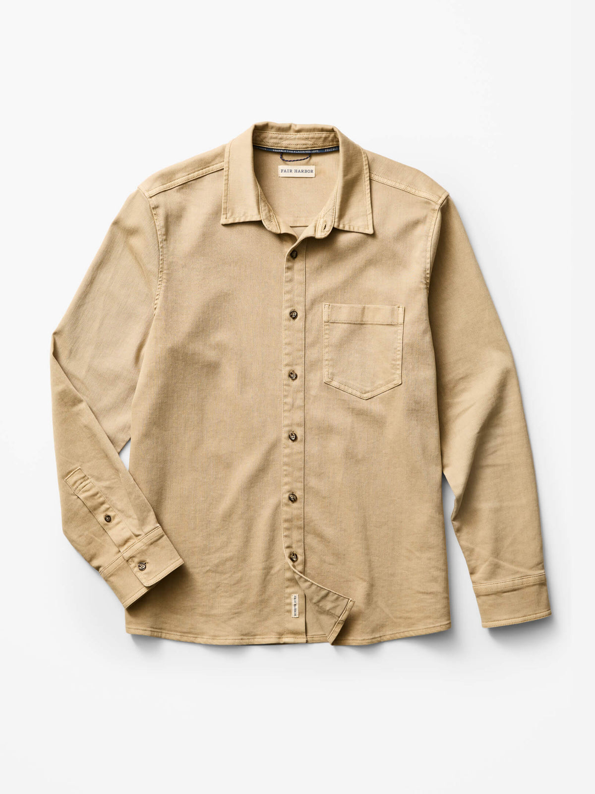 Khaki denim shirt with button front, chest pocket, and long sleeves displayed on white background.