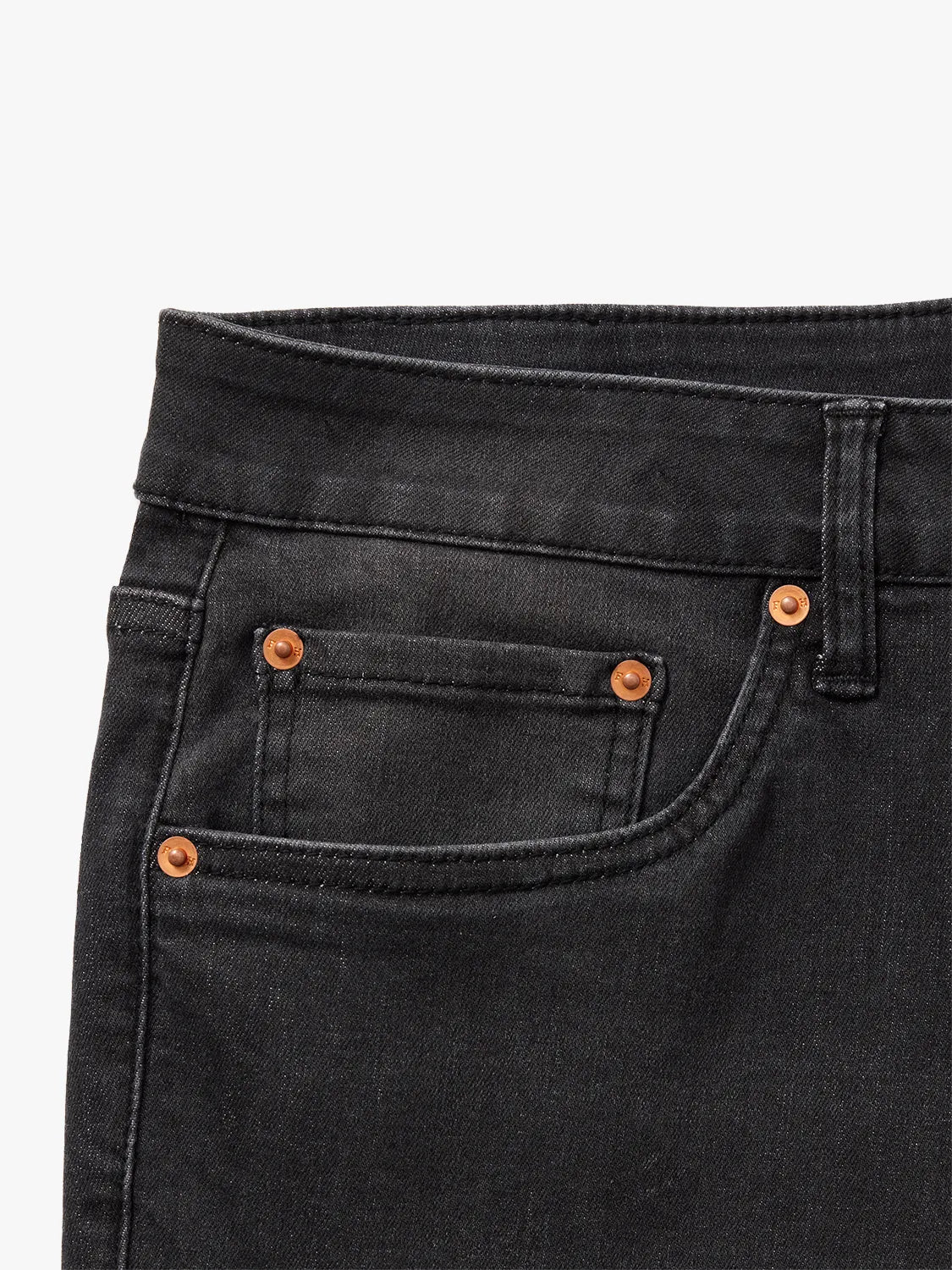 Black wash denim pants with copper button hardware and visible stitch detailing on front pockets.