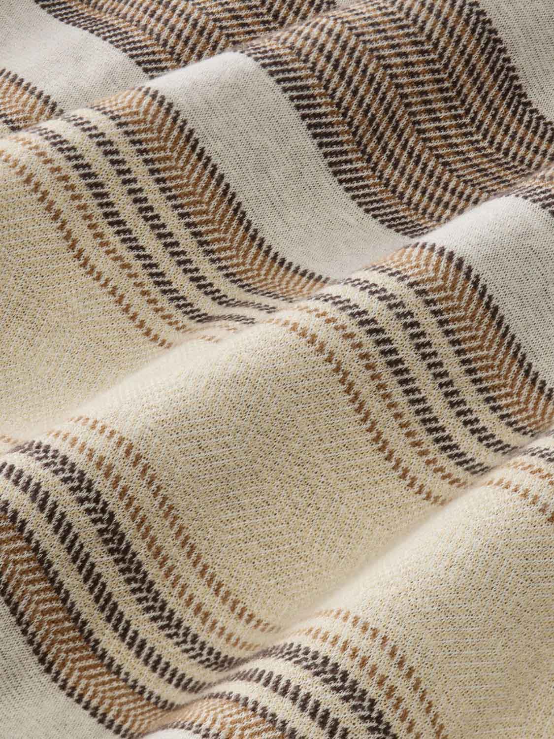 Cream and brown striped flannel fabric with woven herringbone pattern detail in close-up view.