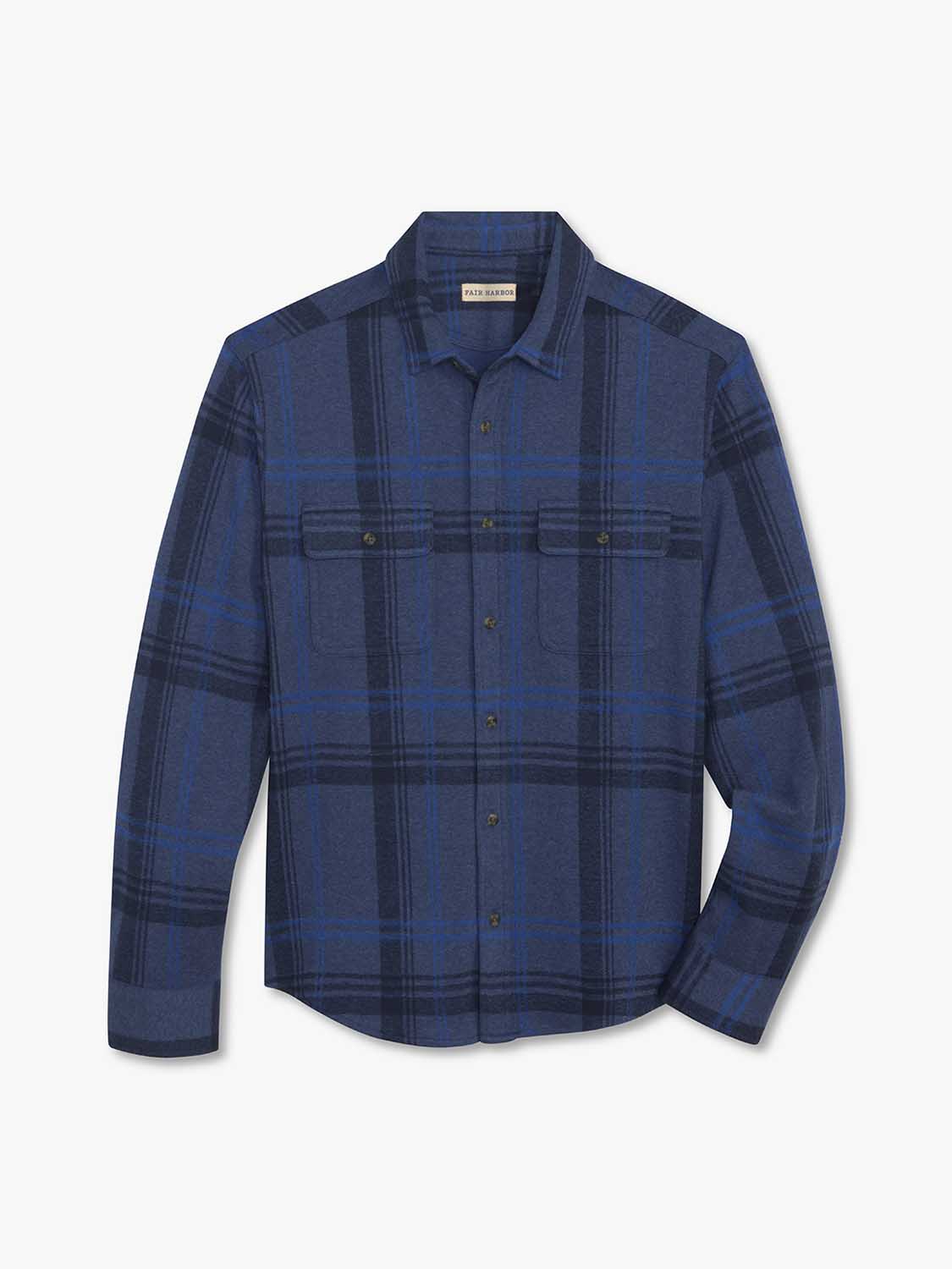 Navy and blue plaid flannel shirt with long sleeves, chest pockets, and button front closure.