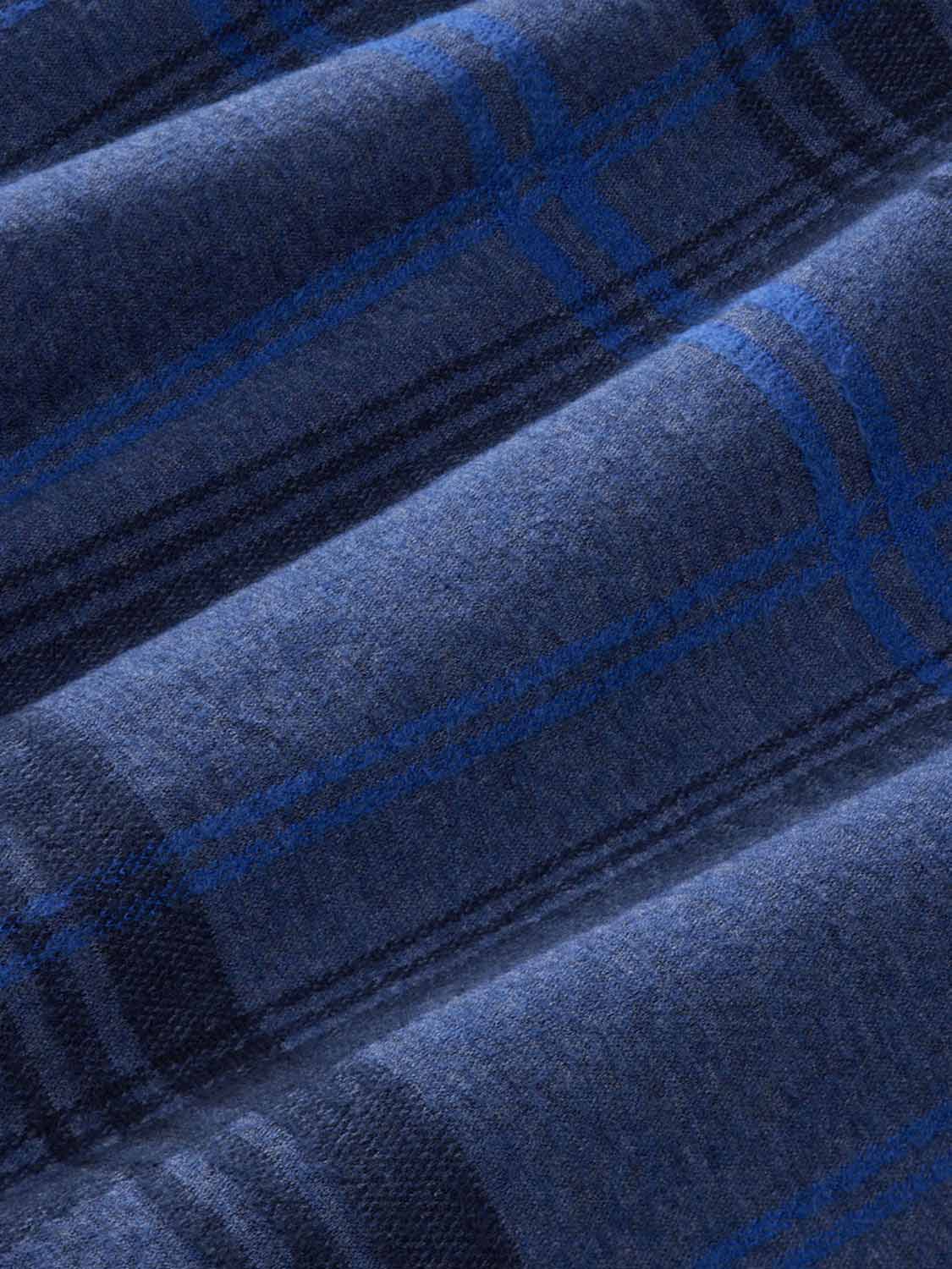 Navy flannel fabric with a water plaid pattern in blue and dark tones.