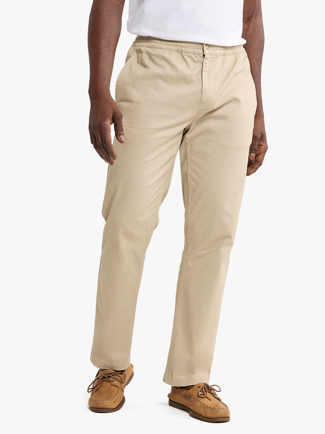Man wearing khaki pull-on pants with elastic waistband and brown boat shoes.