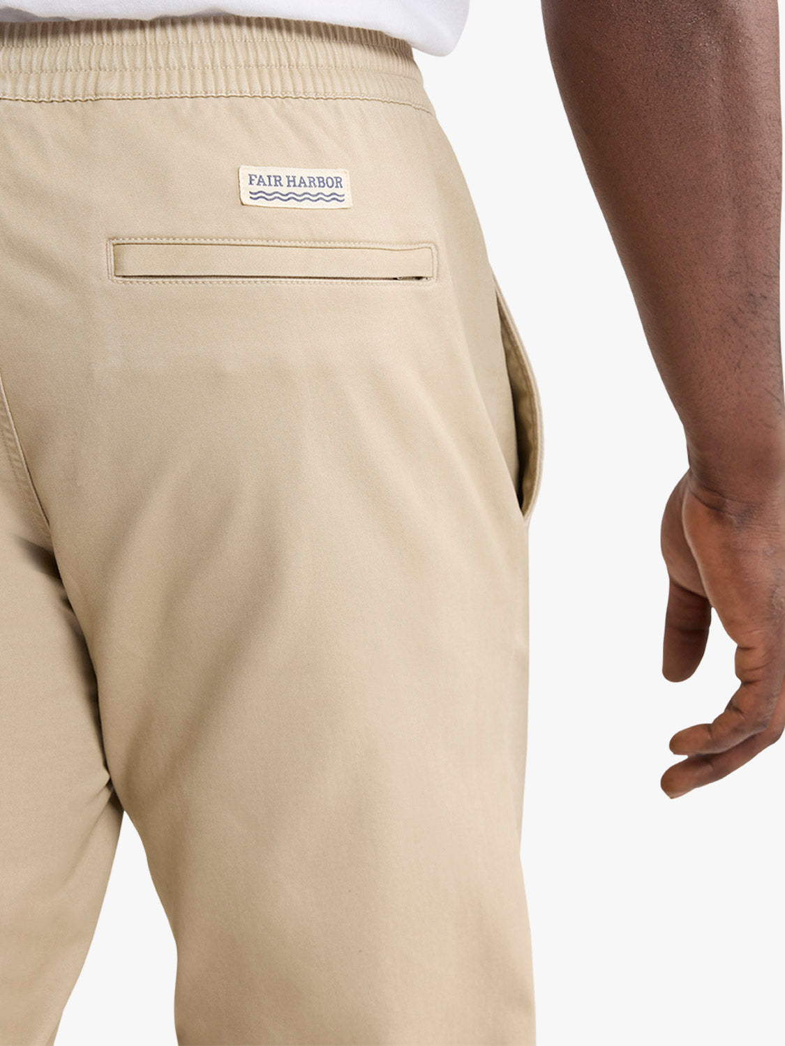 Khaki pull-on pants with Fair Harbor label and back pocket visible on wearer.