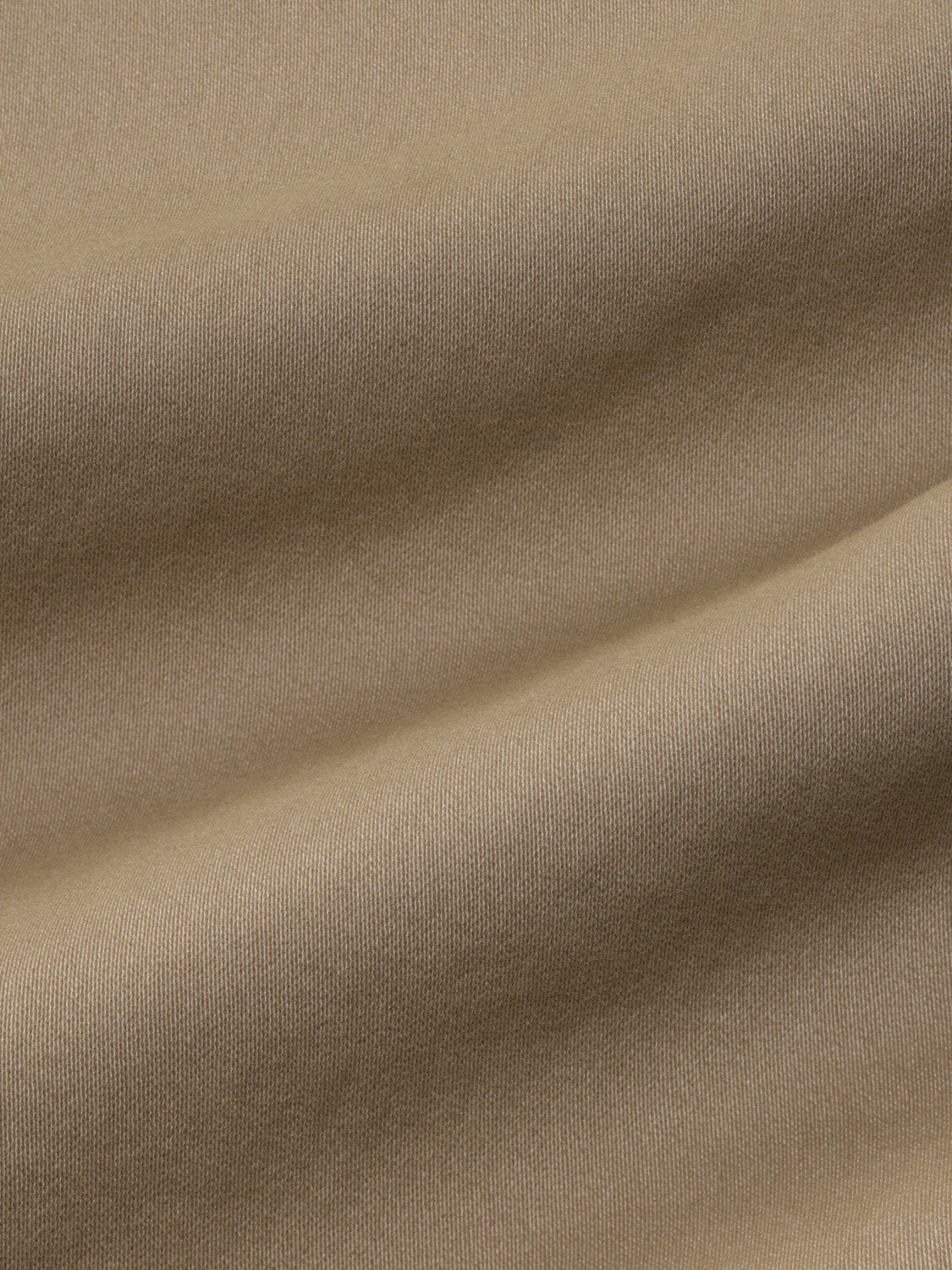 Khaki-colored pull-on pant fabric with a ribbed texture and subtle fold details throughout.