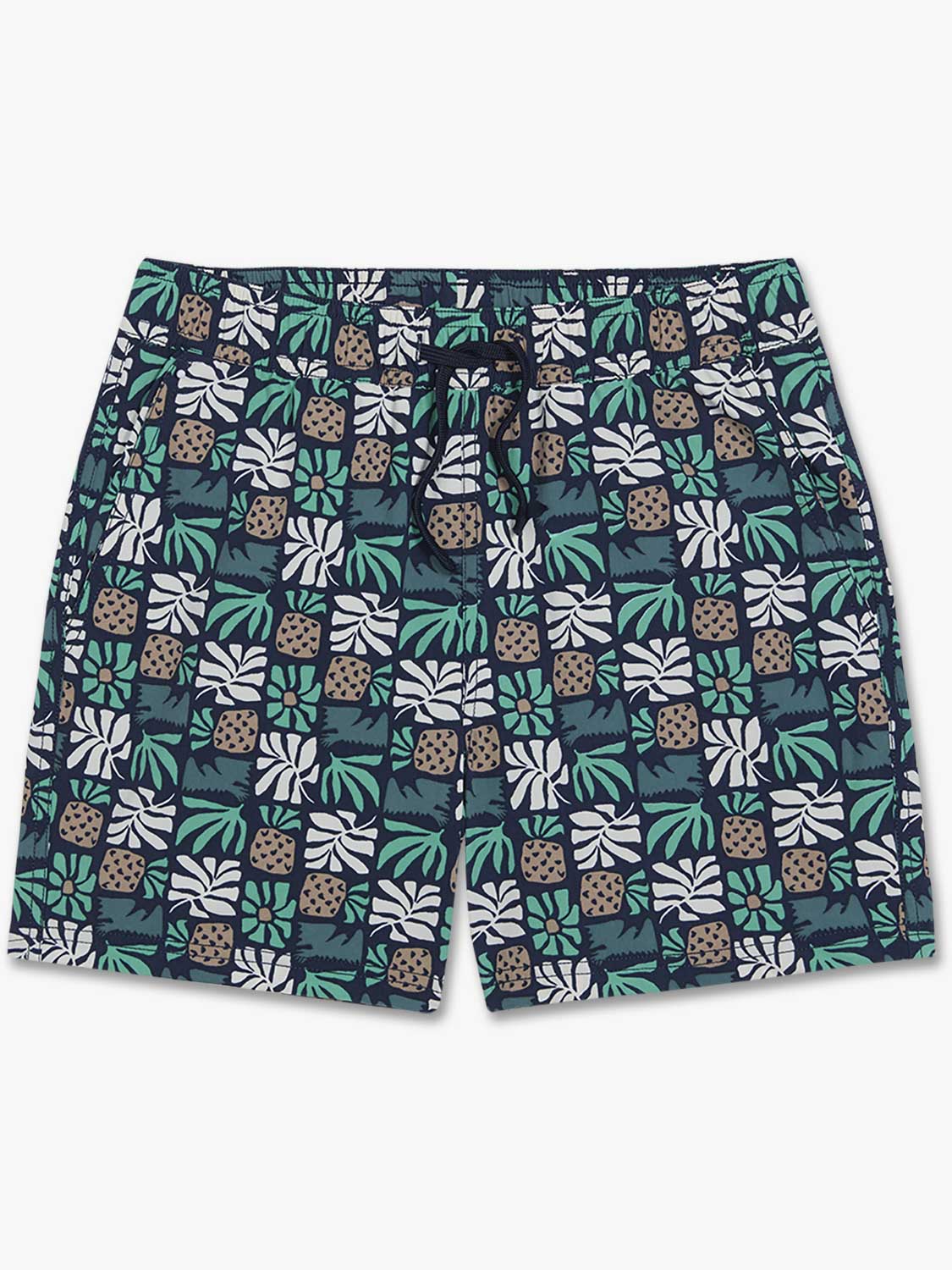 Navy shorts featuring palm leaves, pineapples, and white leaf tile pattern throughout.