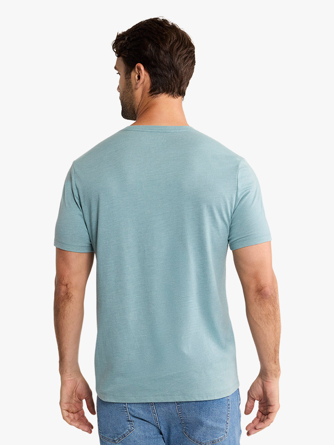 Man wearing a heather green short-sleeve crewneck t-shirt, shown from behind against a white background.