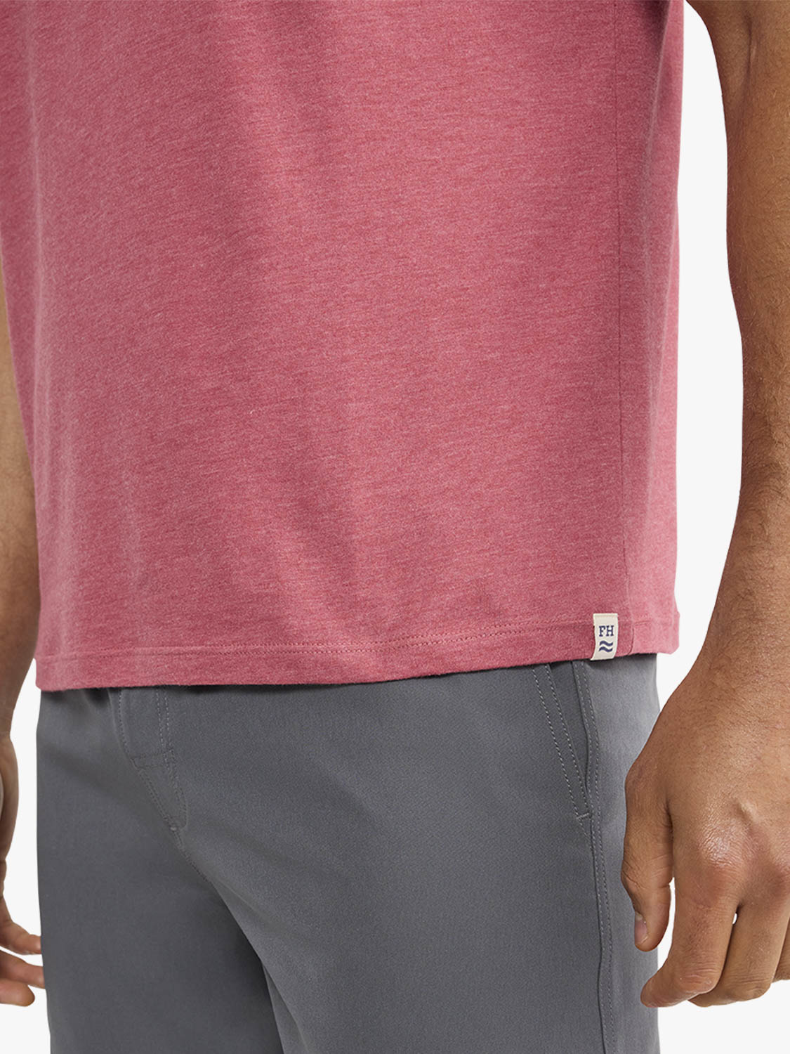 Red heathered t-shirt worn with gray shorts, showing the front and side view of the garment.