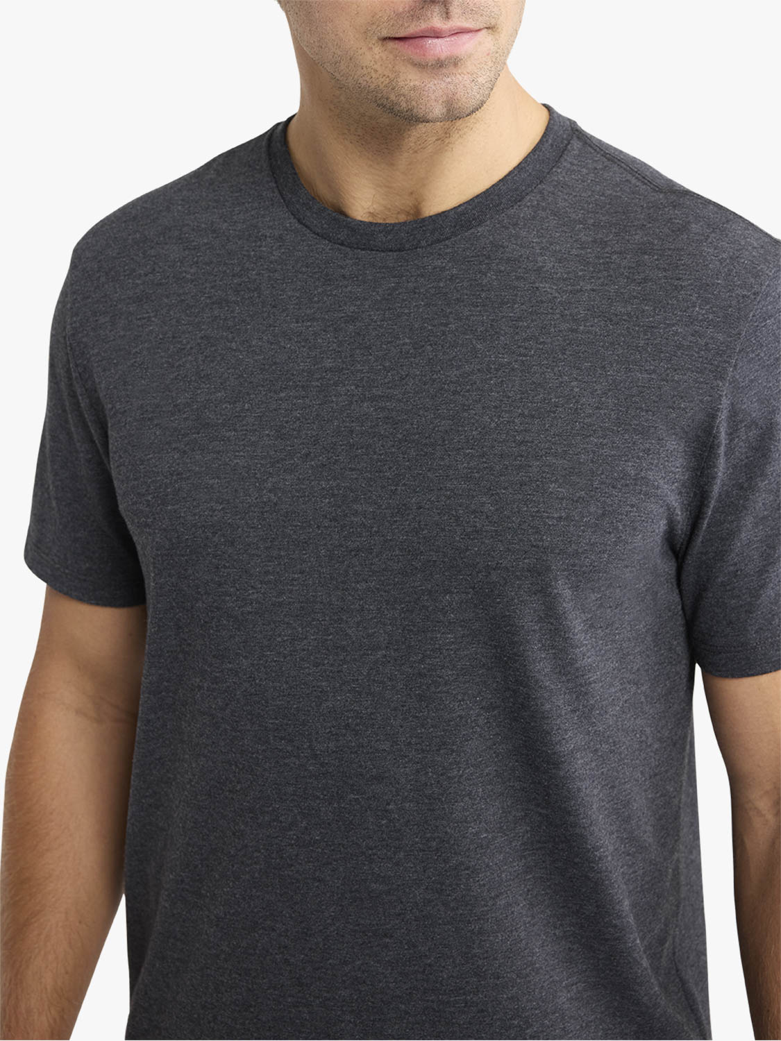 Man wearing a dark gray short-sleeved crew neck t-shirt with a heathered texture.