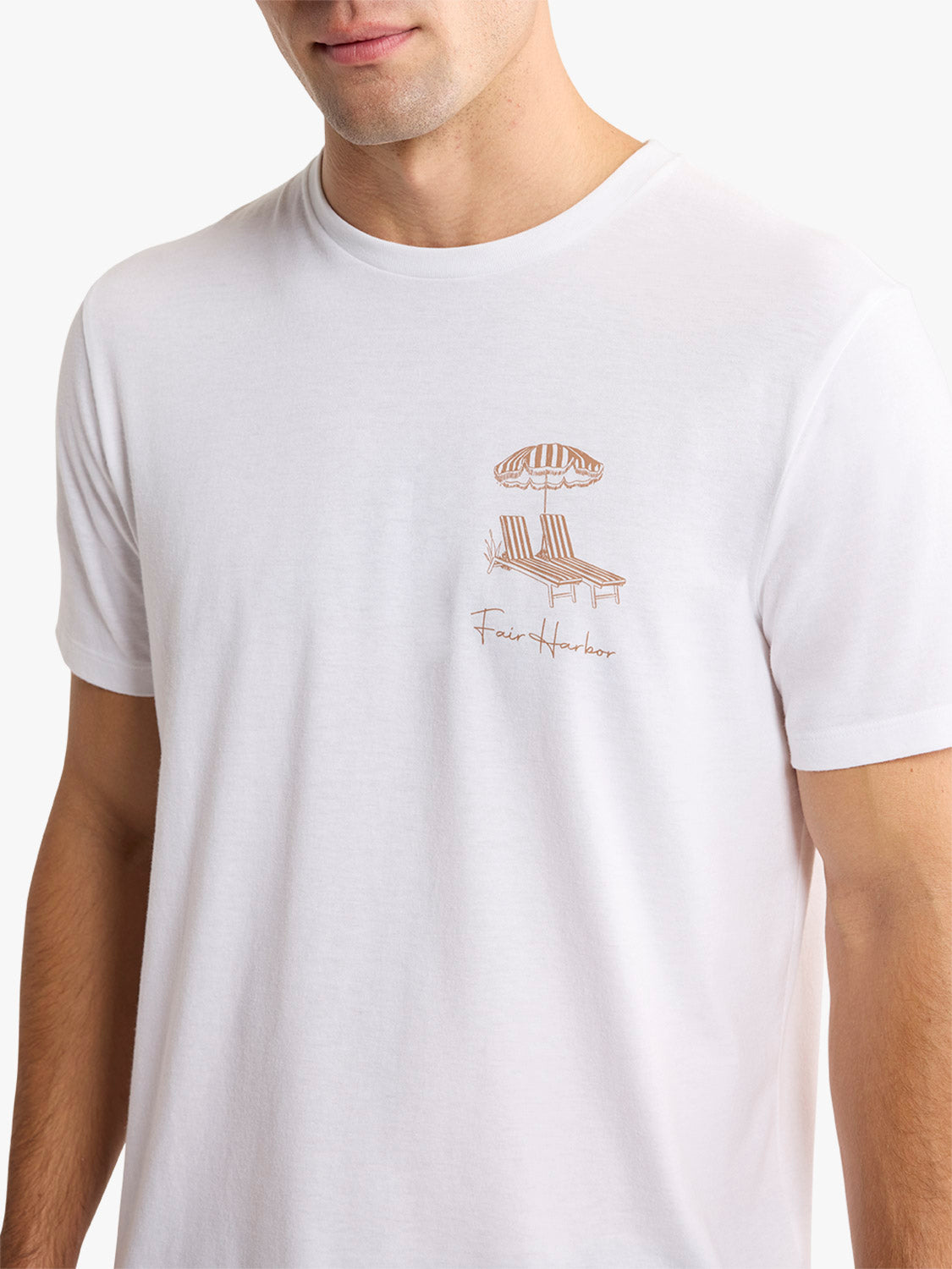 Light pink short-sleeved t-shirt with small chest graphic of beach umbrella and lounge chairs.