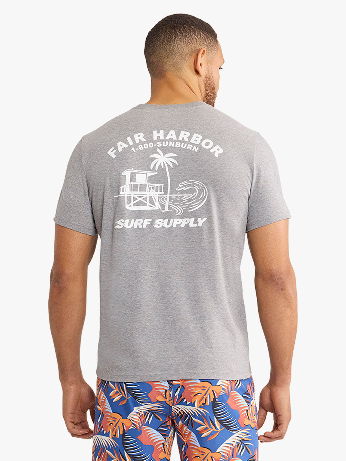 Gray t-shirt with white Fair Harbor lifeguard graphic and palm tree design on back.