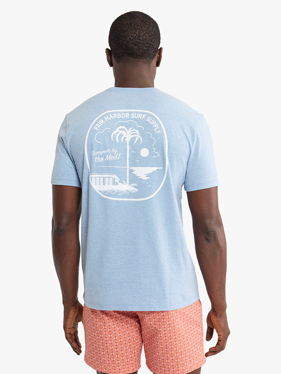 Light blue t-shirt with white graphic print of palm tree and motel design on back.