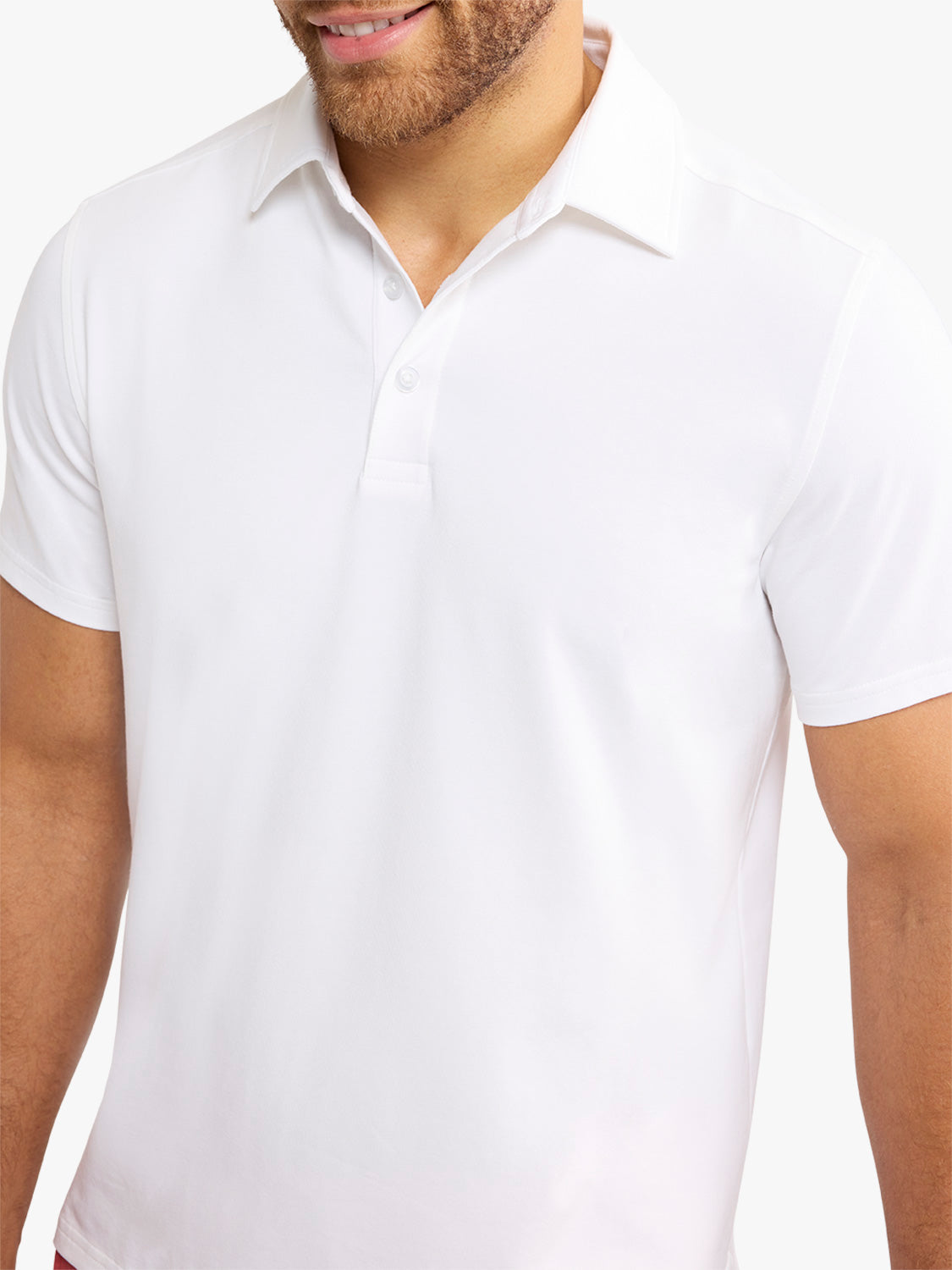 Man wearing a white short-sleeved polo shirt with a collar and button placket.