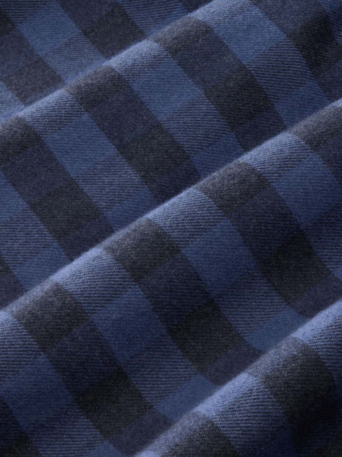 Blue and navy check pattern on lightweight flannel fabric with visible woven texture throughout.