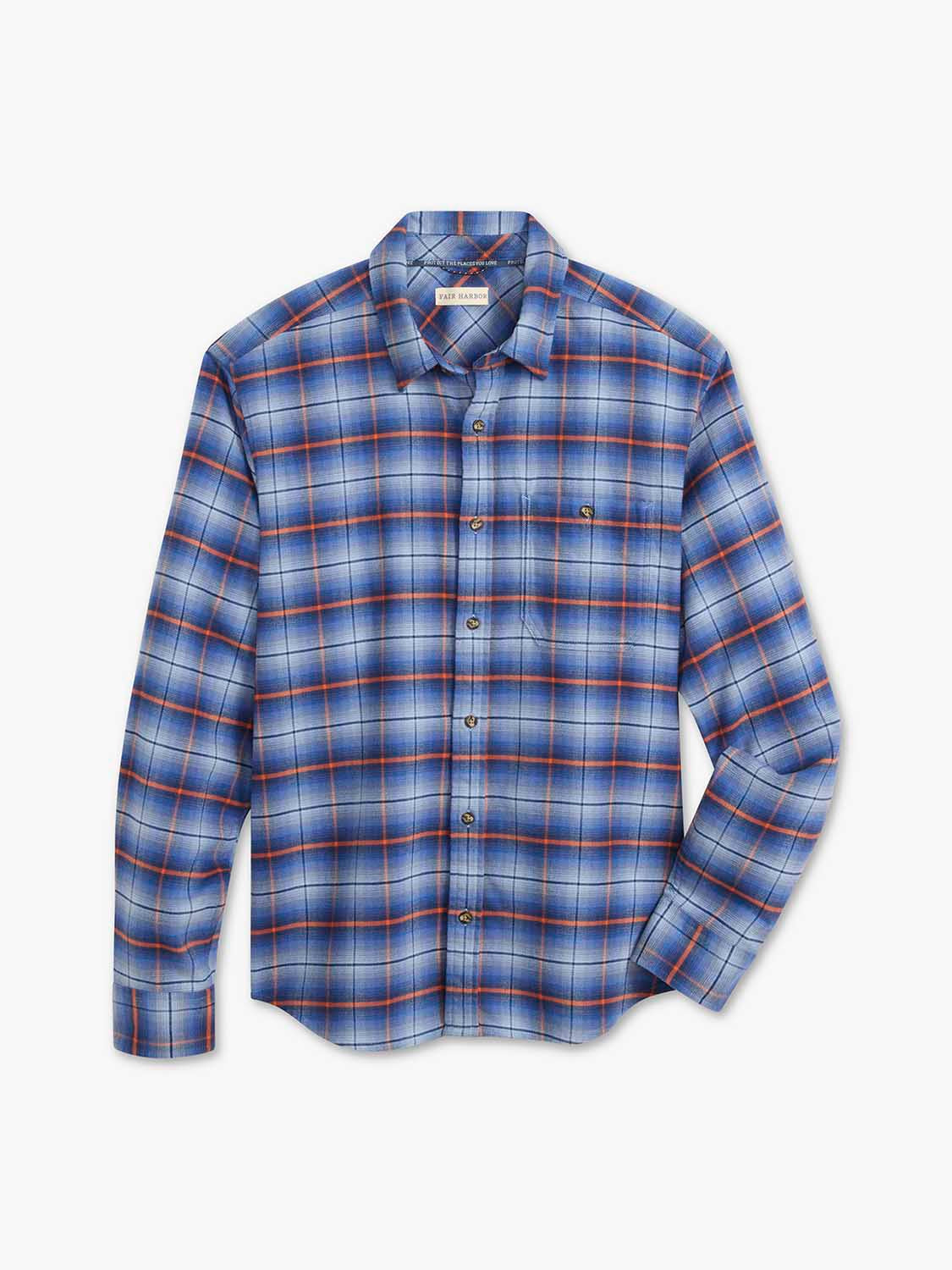 Blue and orange plaid flannel shirt with long sleeves and button front closure displayed flat.