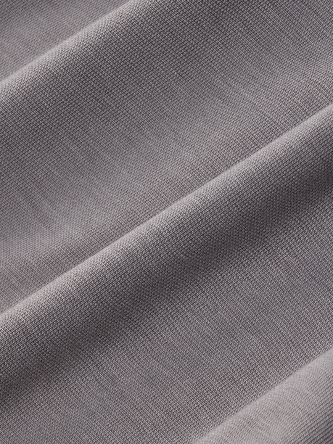 Gray ribbed fabric hoodie with visible texture and subtle folds throughout the material.