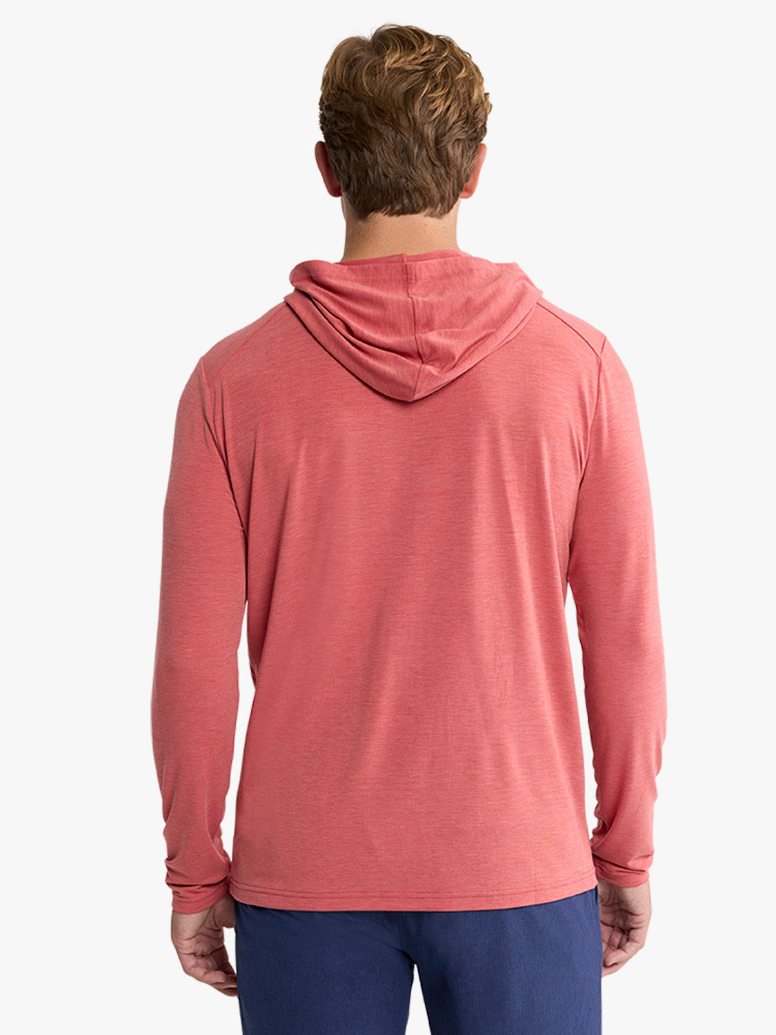 Man wearing a mineral red hoodie with long sleeves, shown from behind against a white background.