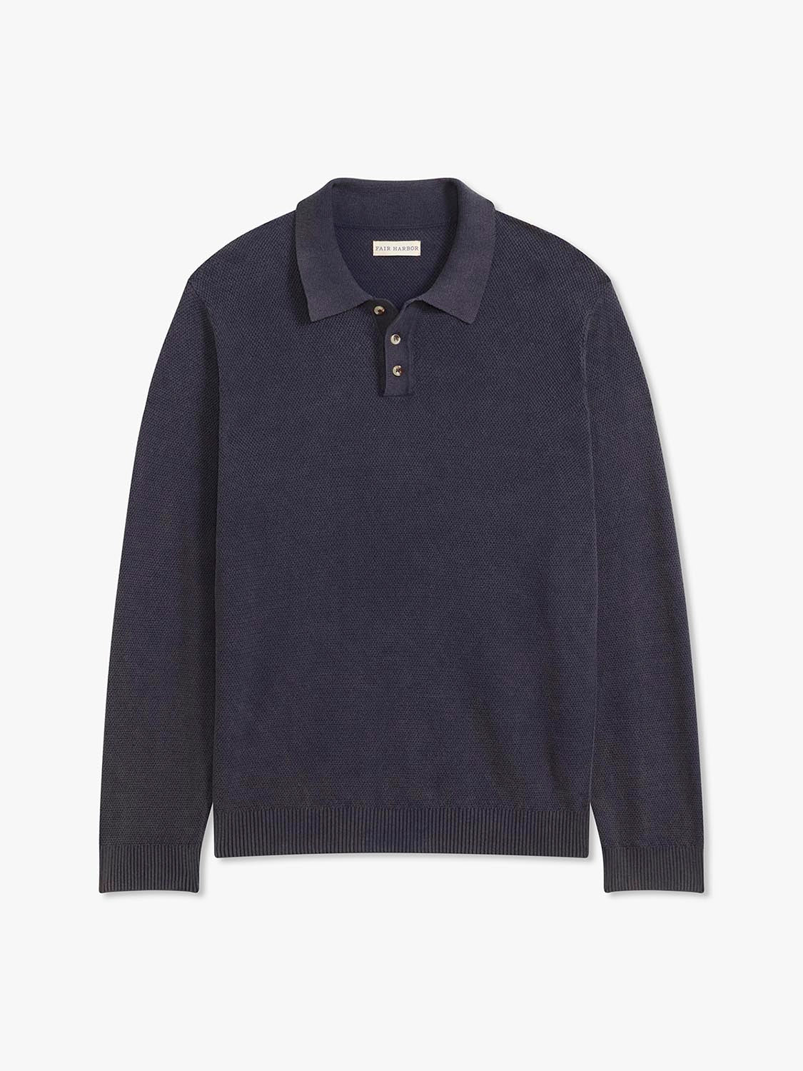 Navy long sleeve polo sweater with collar and button placket displayed flat against white background.