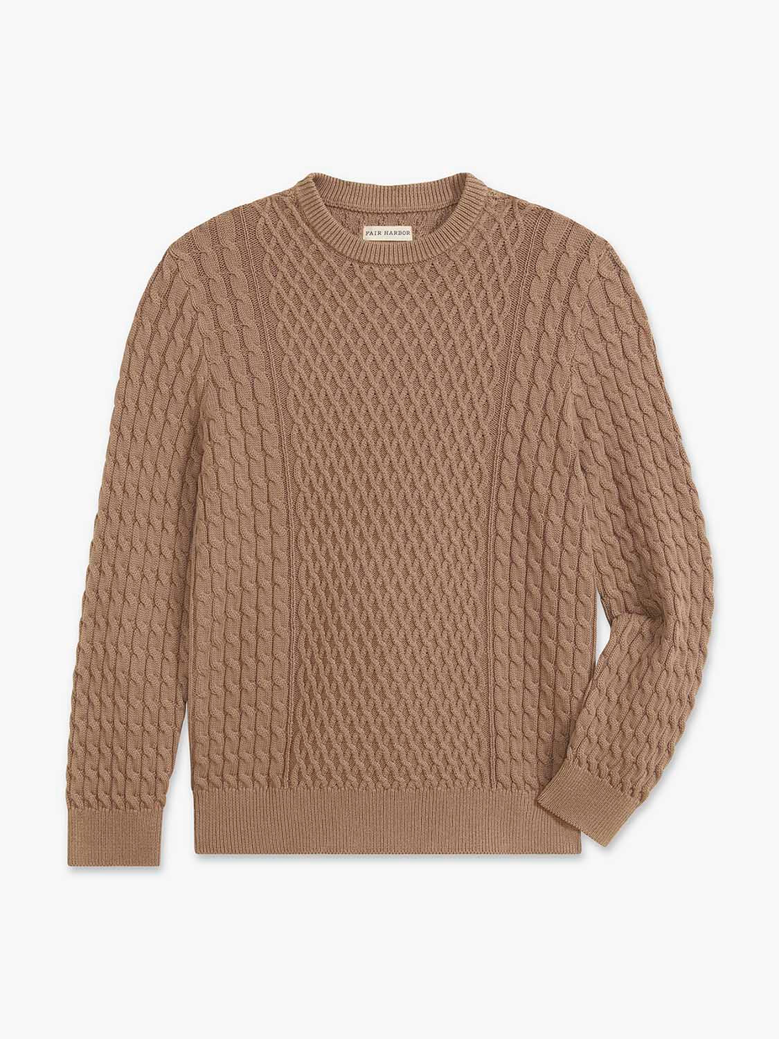 Tan cable knit crewneck sweater with long sleeves and ribbed trim details.