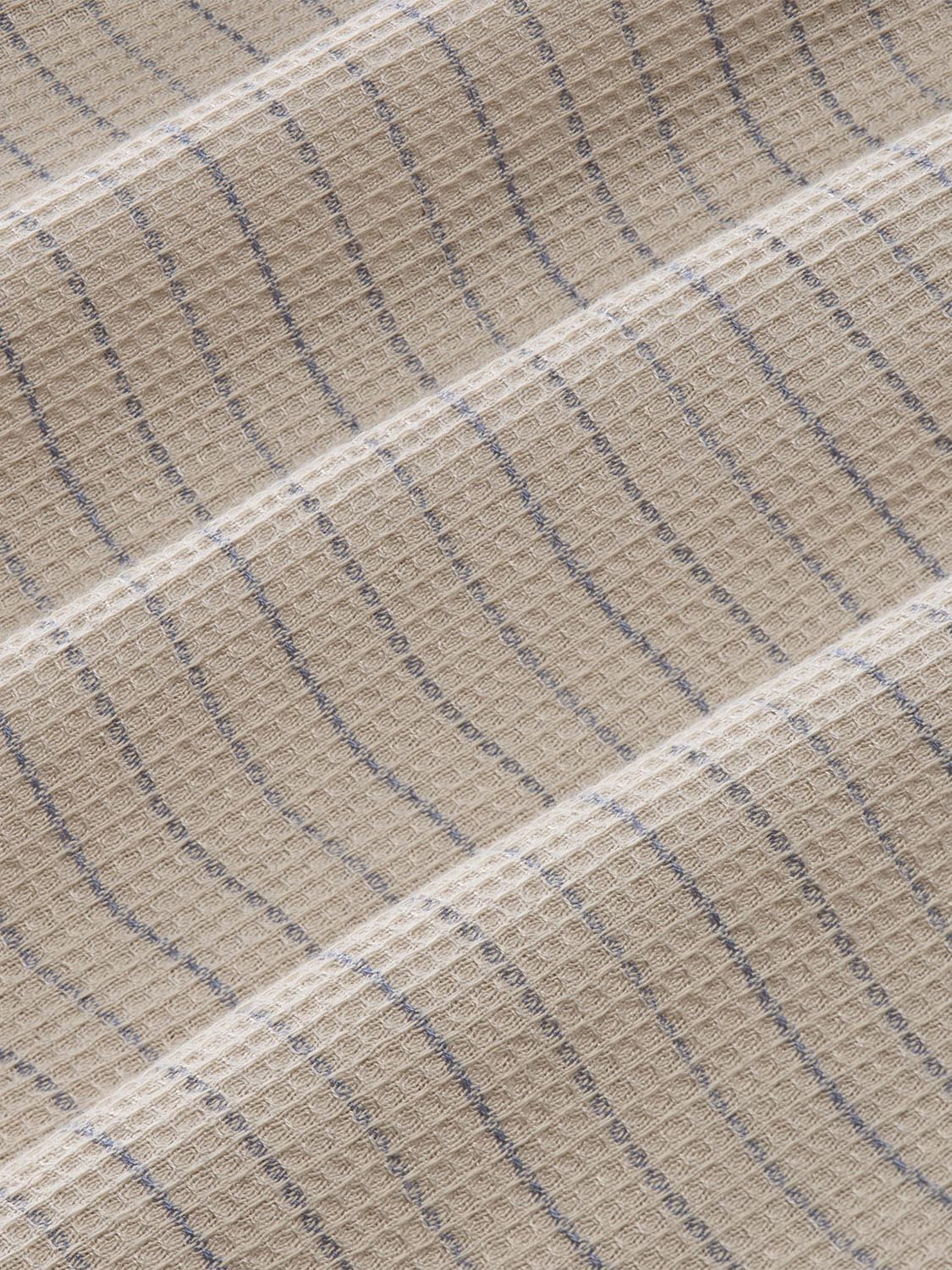 Beige waffle stripe fabric with blue and cream horizontal stripes in textured weave pattern.