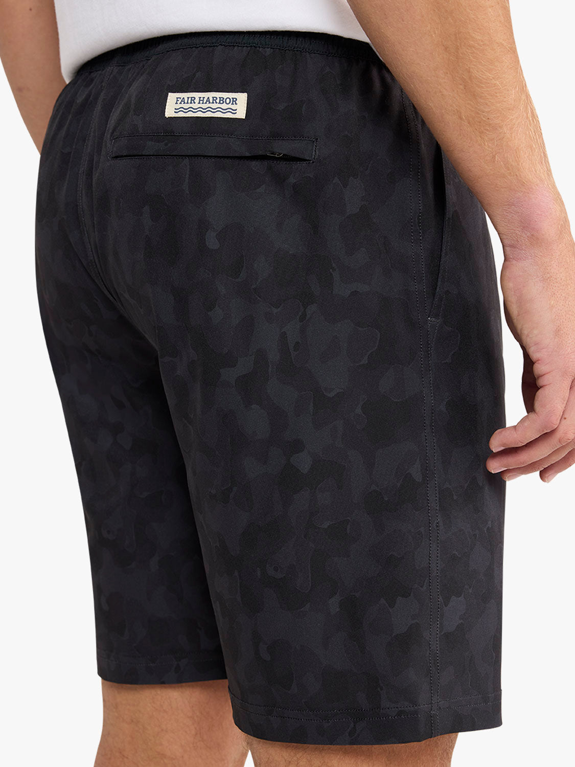 Black camo shorts with Fair Harbor label and back pocket displayed on model from waist down.