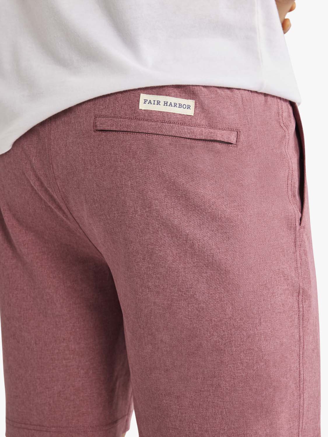 Burgundy shorts with a Fair Harbor label visible on the back waistband and back pocket.