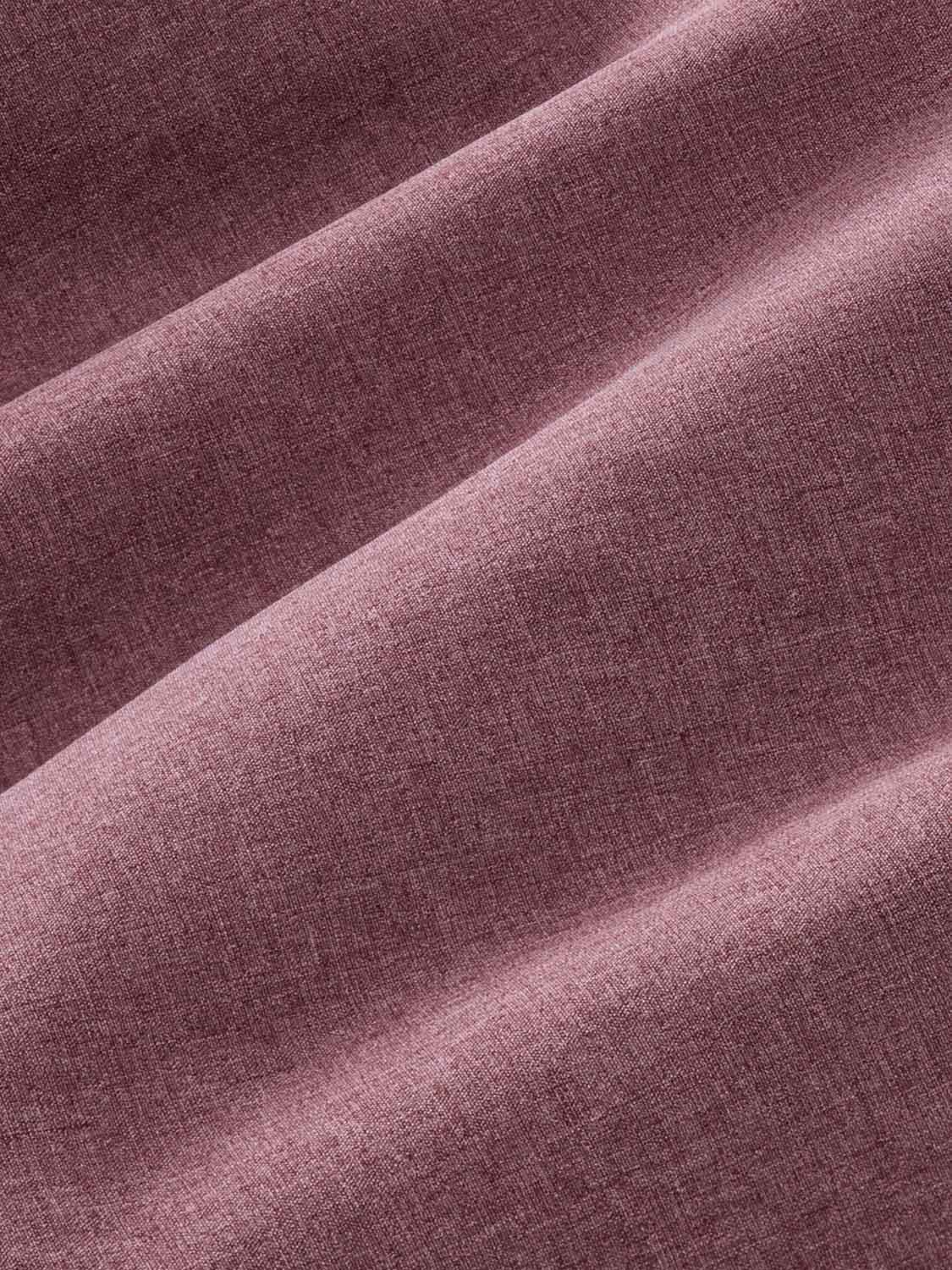 Burgundy fabric with textured weave and diagonal folds creating light and shadow patterns.