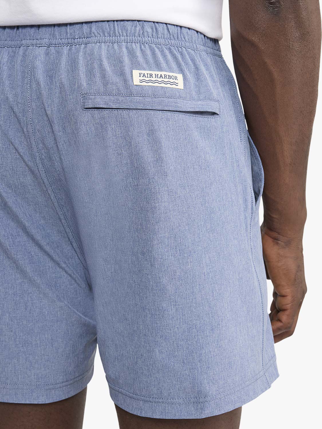 Light blue shorts with Fair Harbor brand label and back pocket on wearer's body.