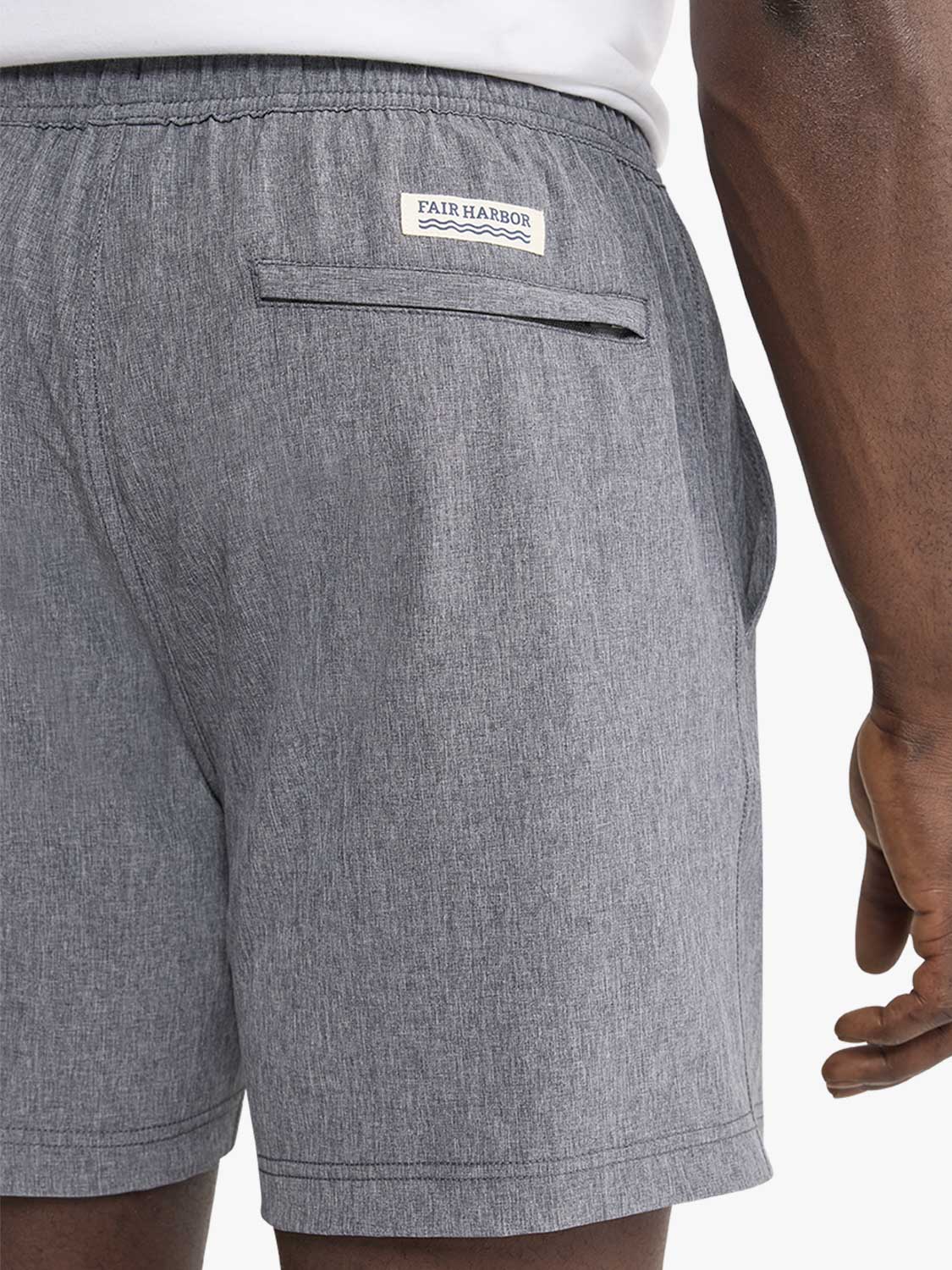 Gray shorts with elastic waistband and Fair Harbor brand label on back pocket.