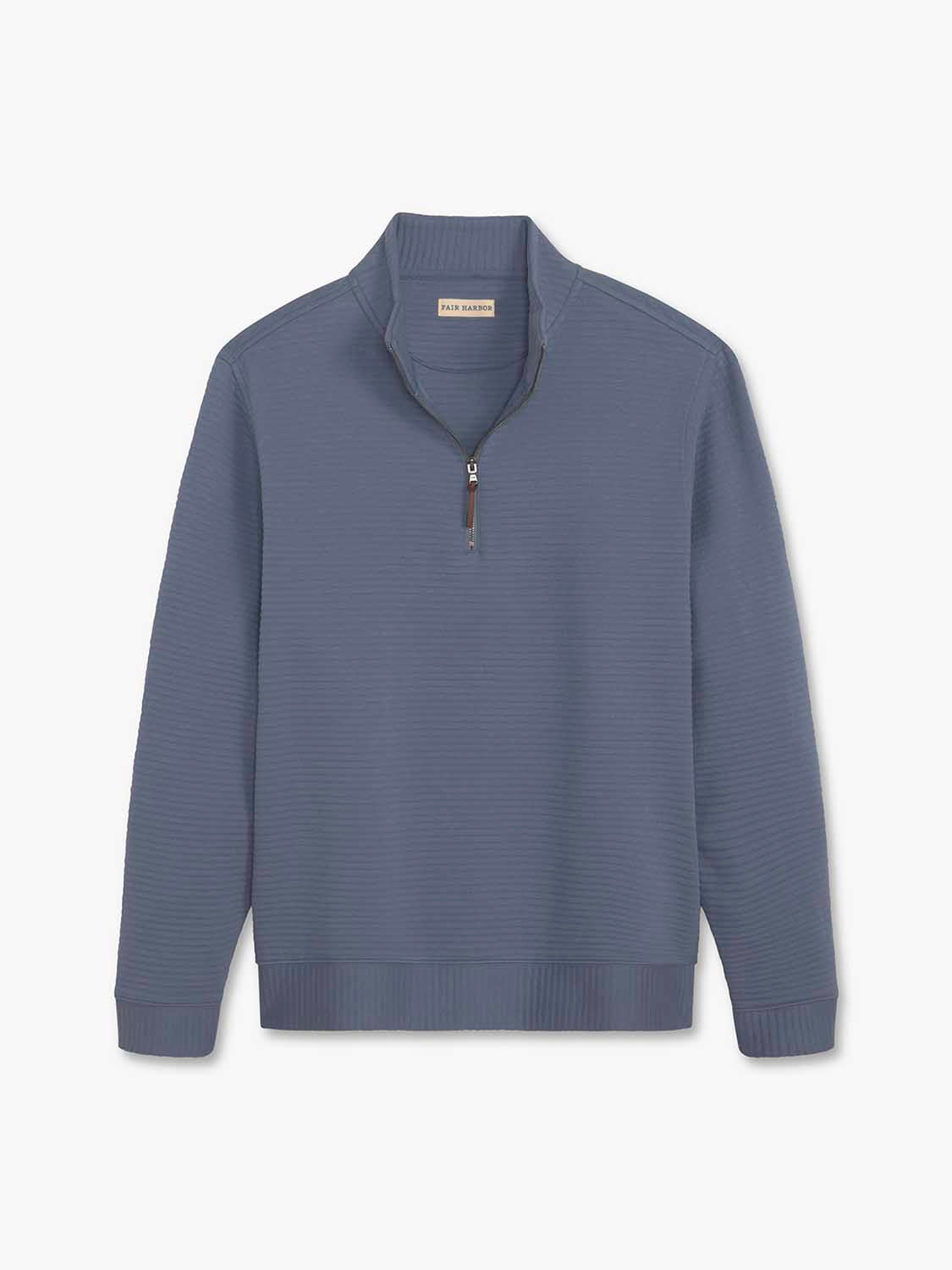 Blue-gray quarter zip pullover with ribbed texture, brown zip pull, and crew neckline displayed flat.