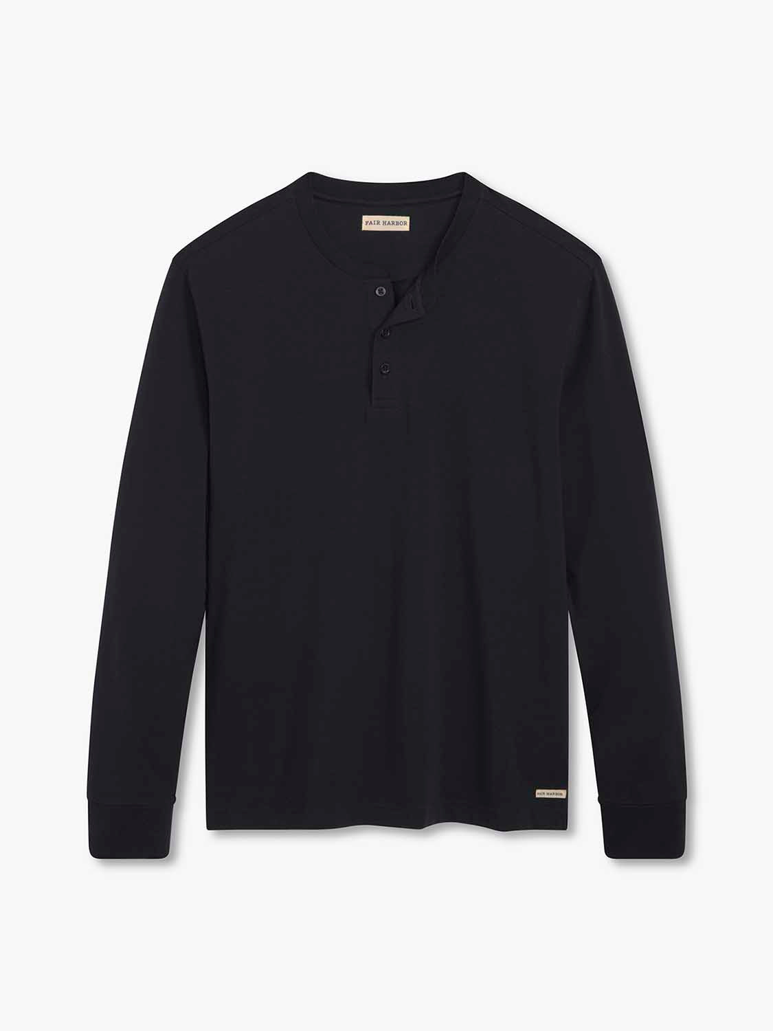 Black long-sleeve henley shirt with button placket and brand label visible.