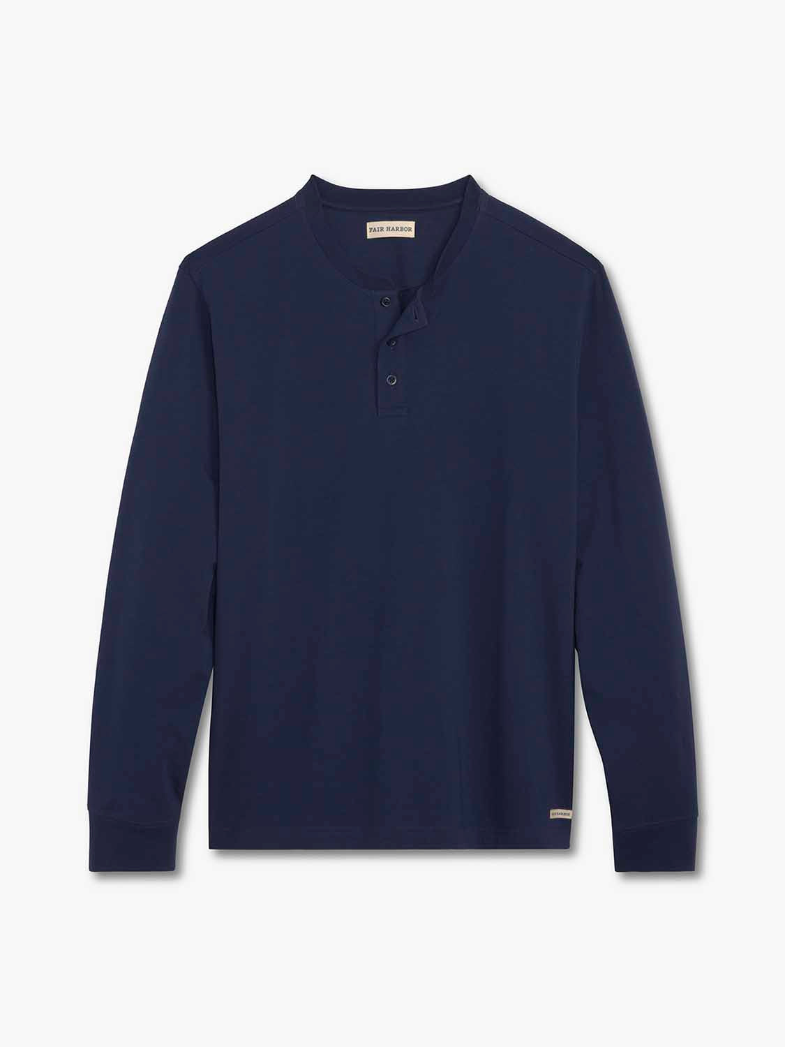 Navy blue long-sleeve henley shirt with button placket and ribbed cuffs displayed flat.