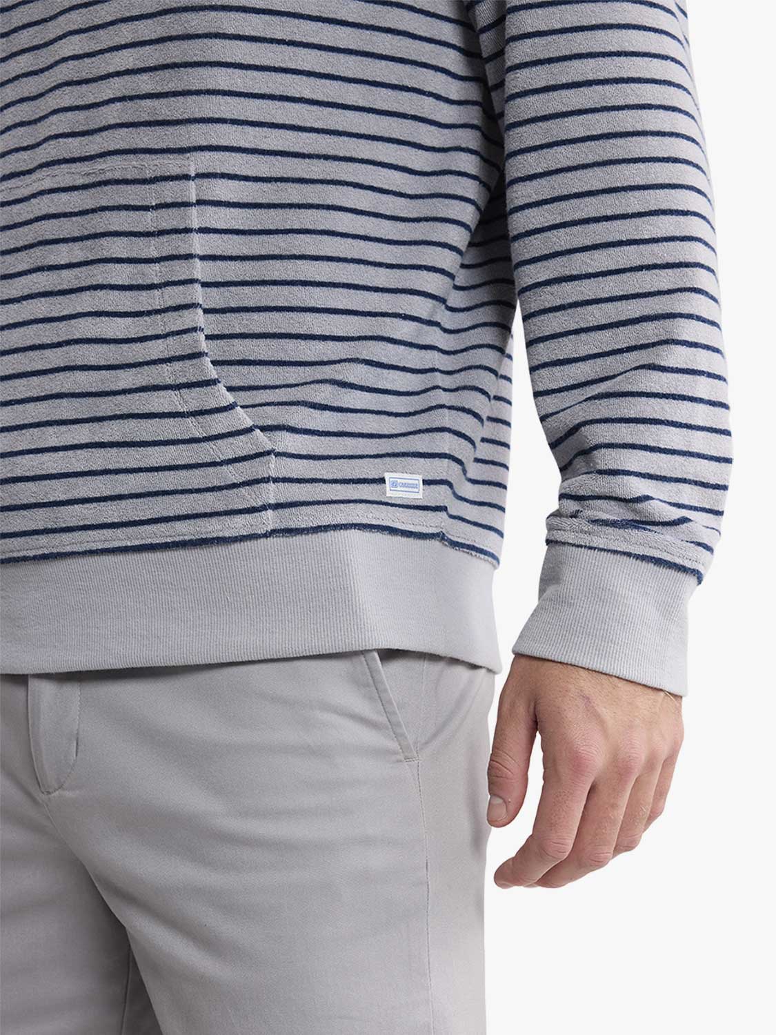 Gray and navy striped terry hoodie with ribbed cuffs and light gray drawstring details visible.