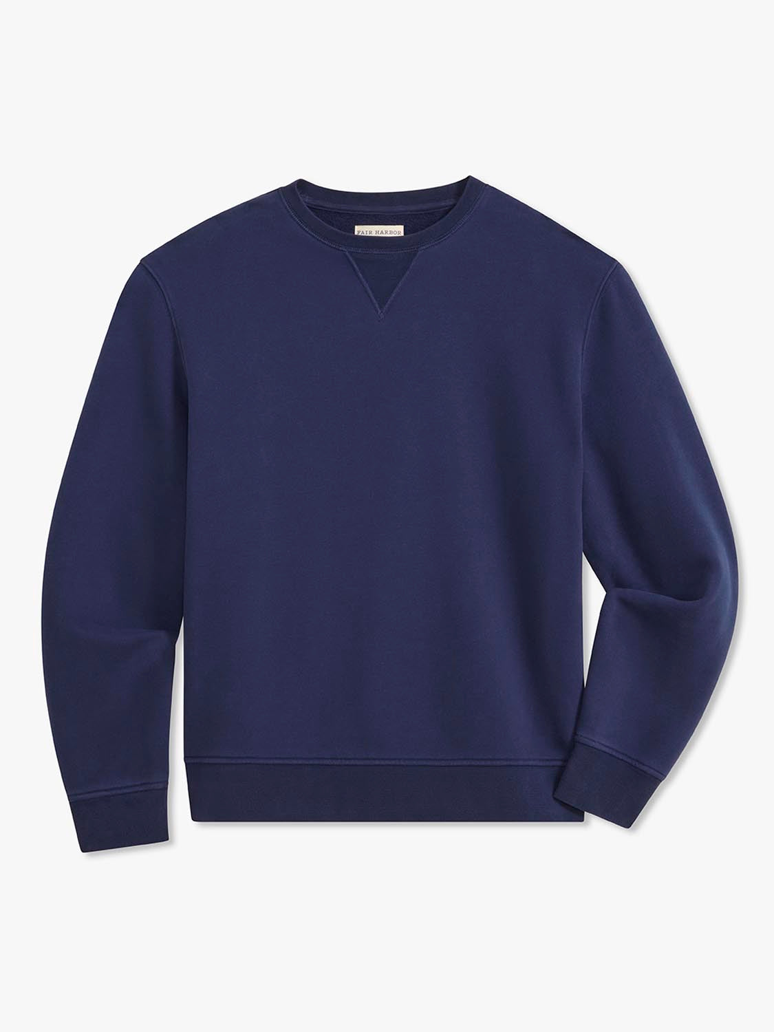 Navy crewneck sweatshirt with long sleeves and ribbed cuffs displayed on a neutral background.