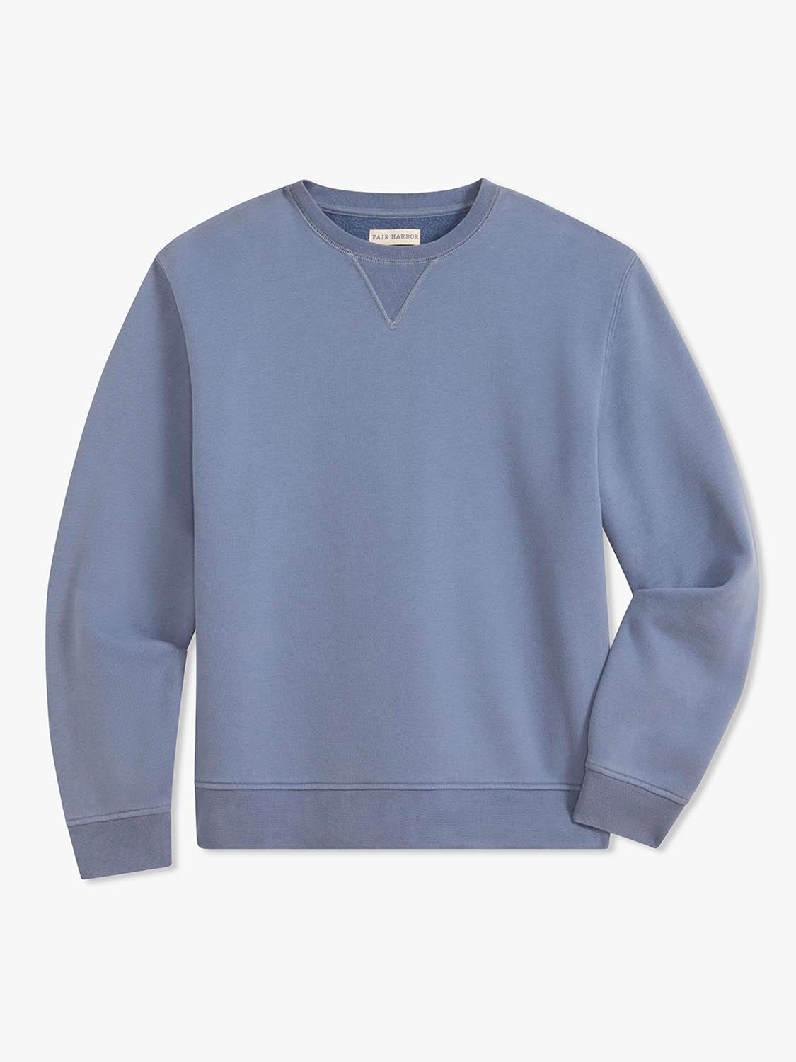 Blue crewneck sweatshirt with long sleeves and ribbed cuffs displayed on white background.